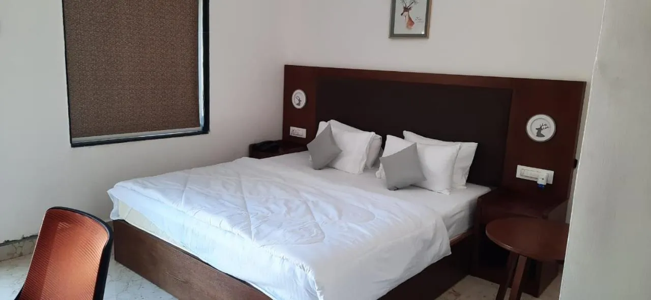 Bed in Aranya Resort by Mrugavani