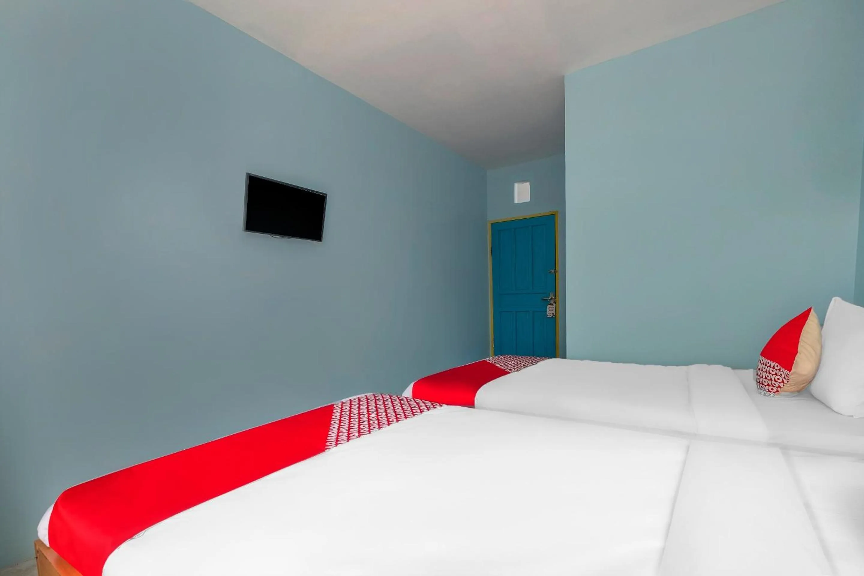 Bedroom in Hotel O RF Homestay