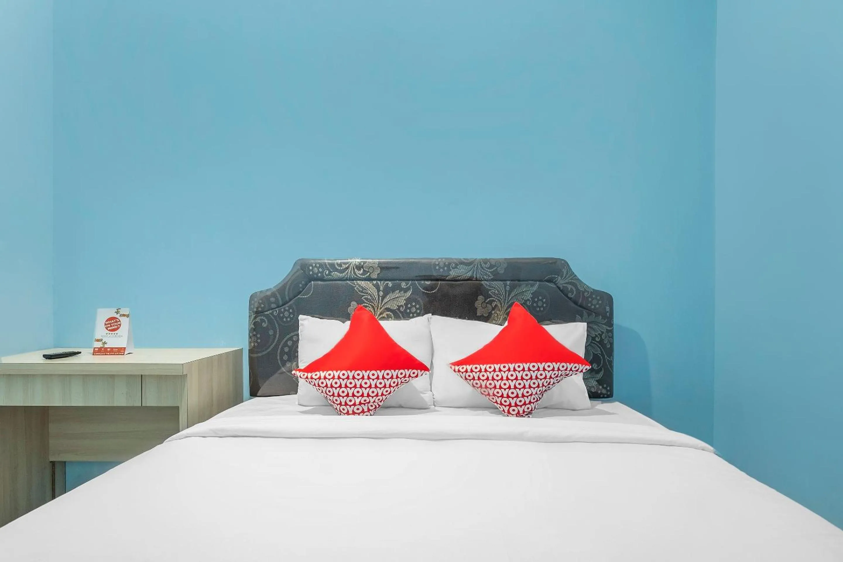 Bedroom in Hotel O RF Homestay