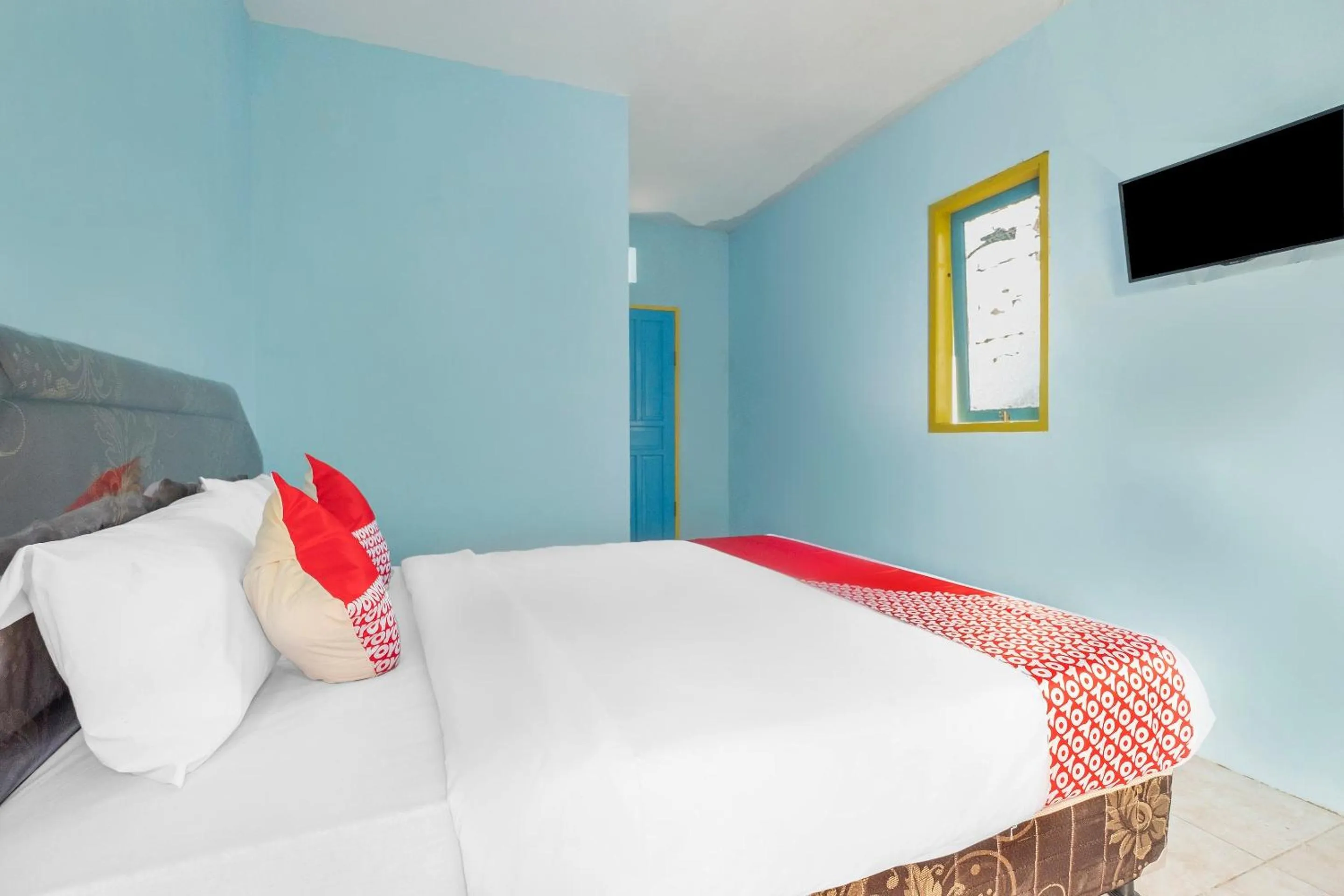 Bedroom in Hotel O RF Homestay