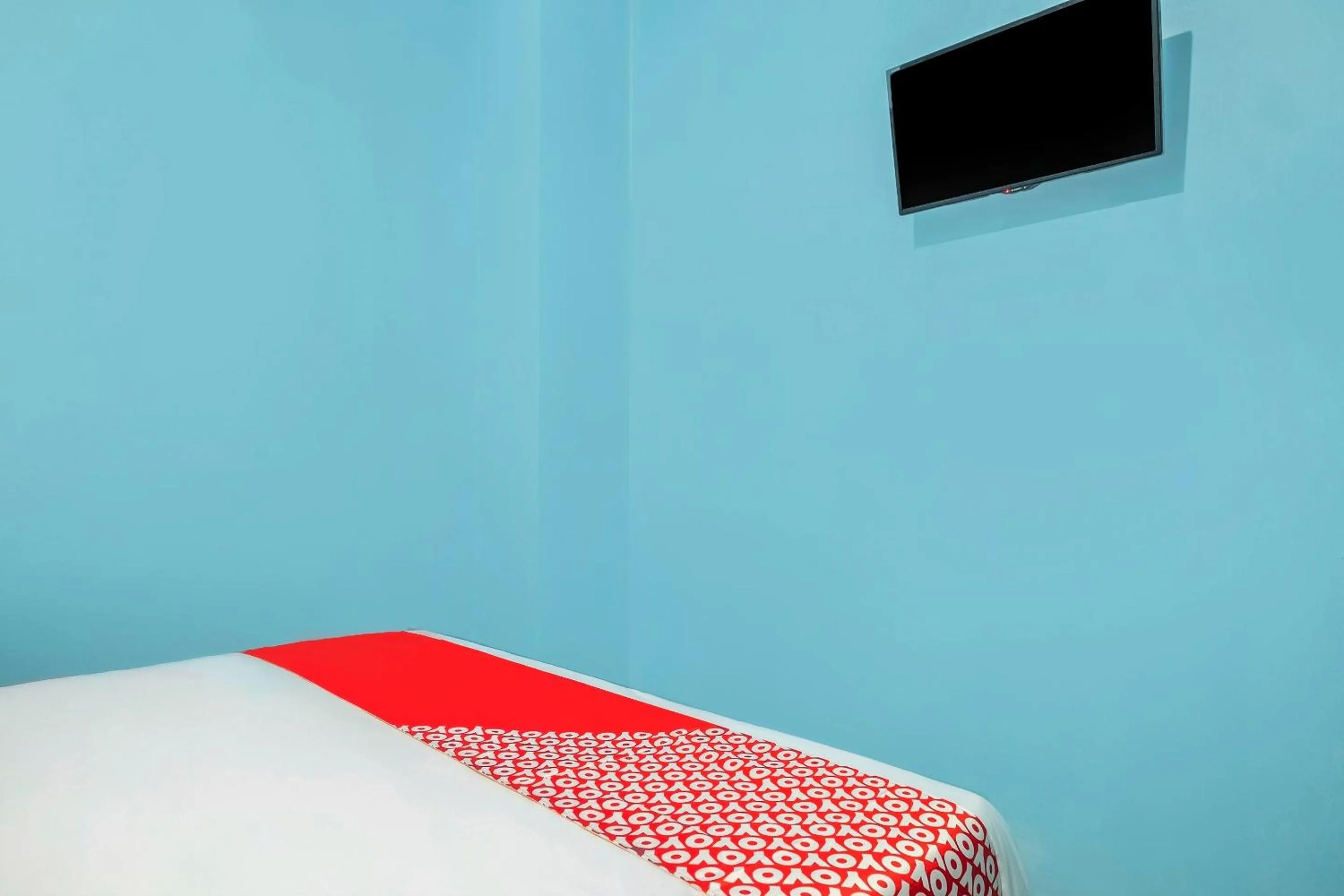 Bedroom in Hotel O RF Homestay