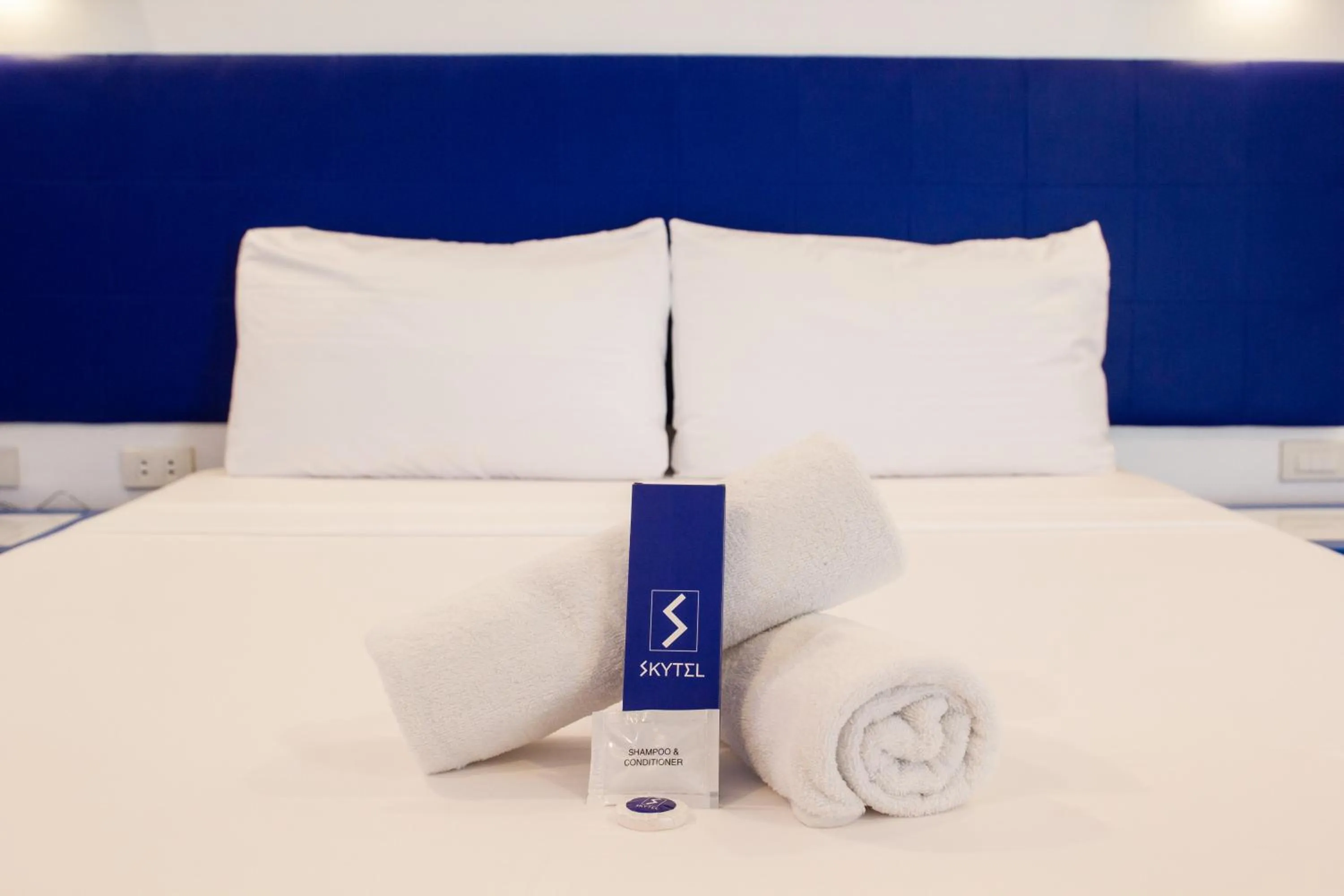 Bed in Skytel Palawan