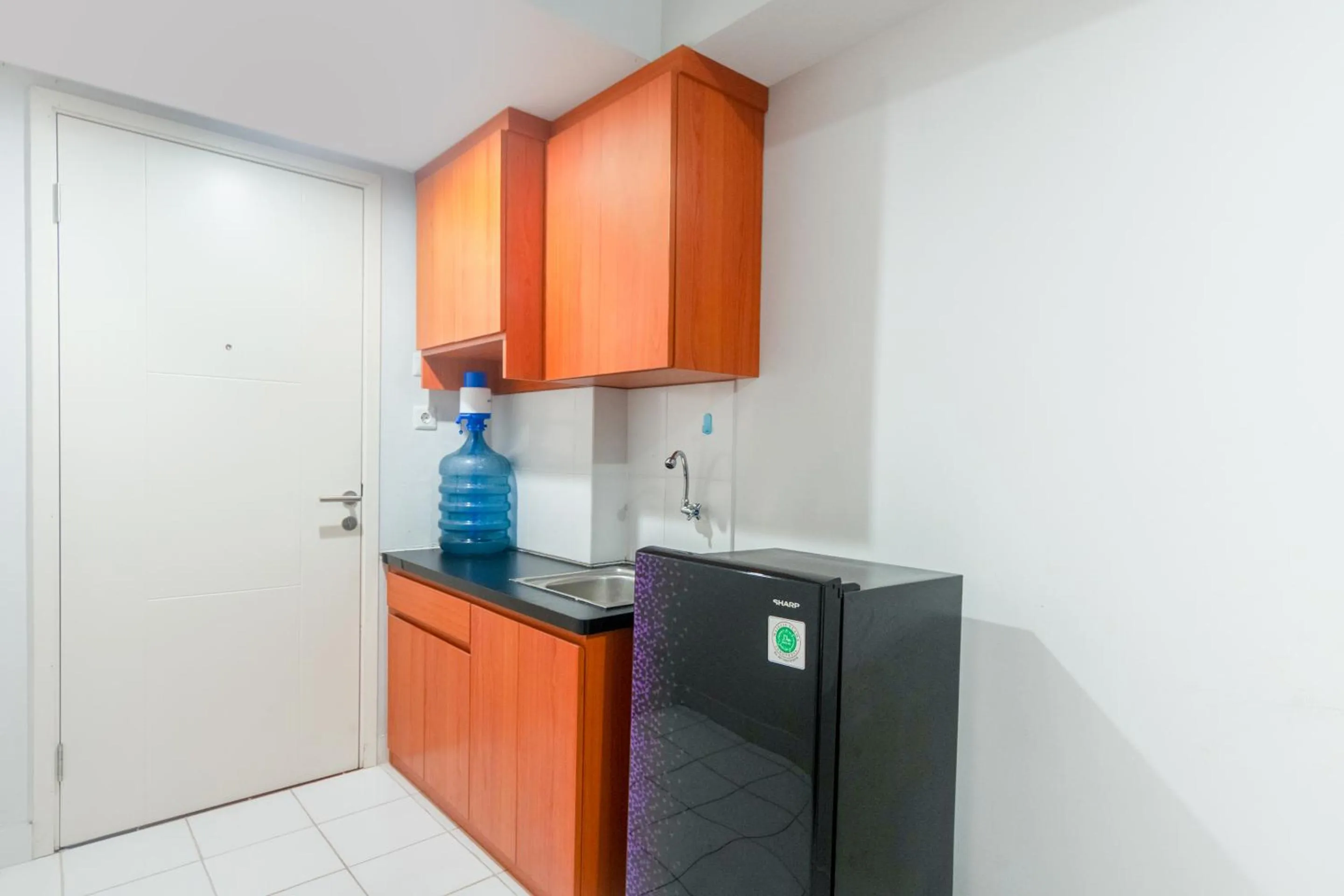 Kitchen or kitchenette in OYO Life 2837 Apartment Dramaga Tower