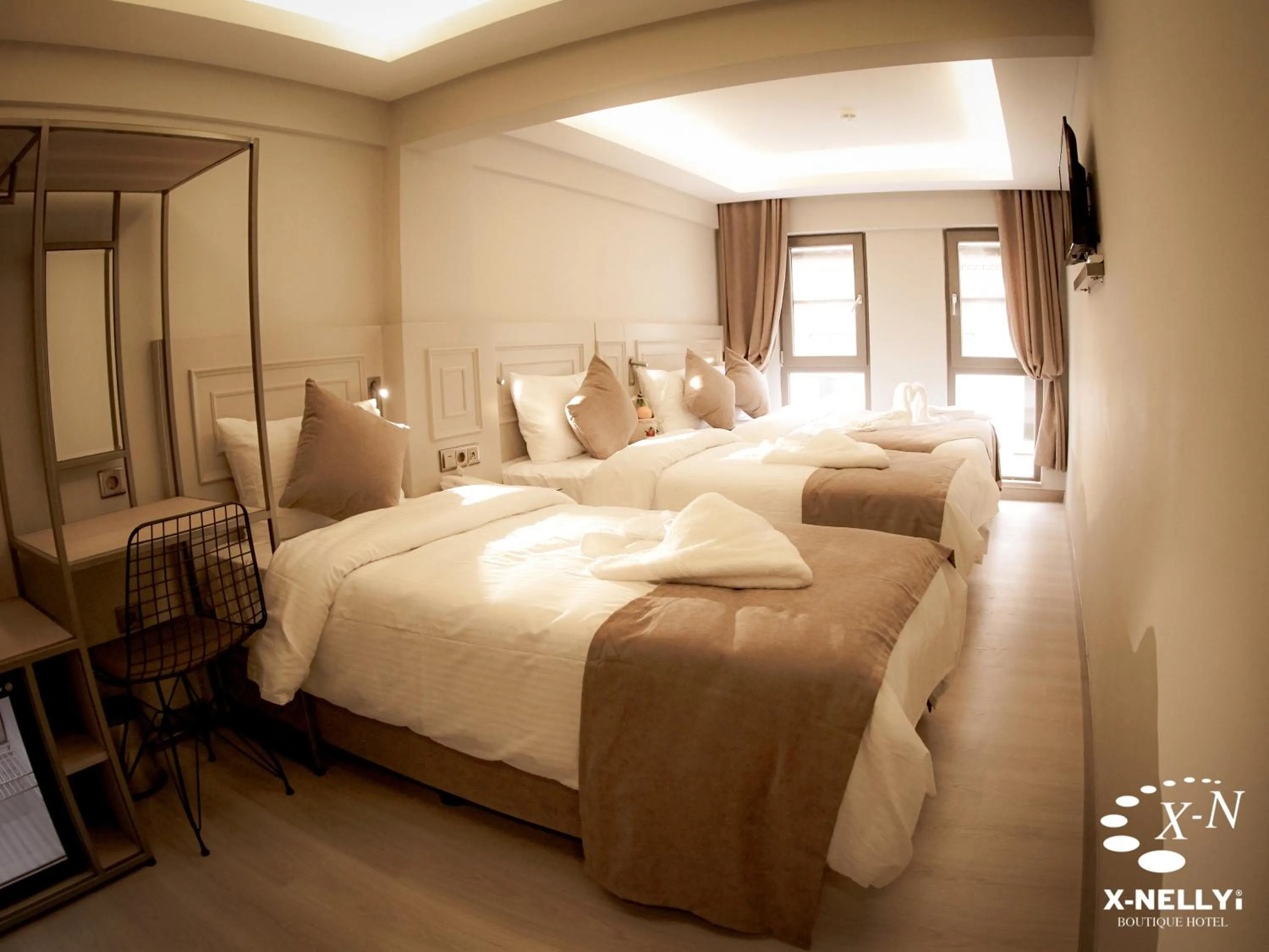 Bed in X-NELLYİ HOTEL