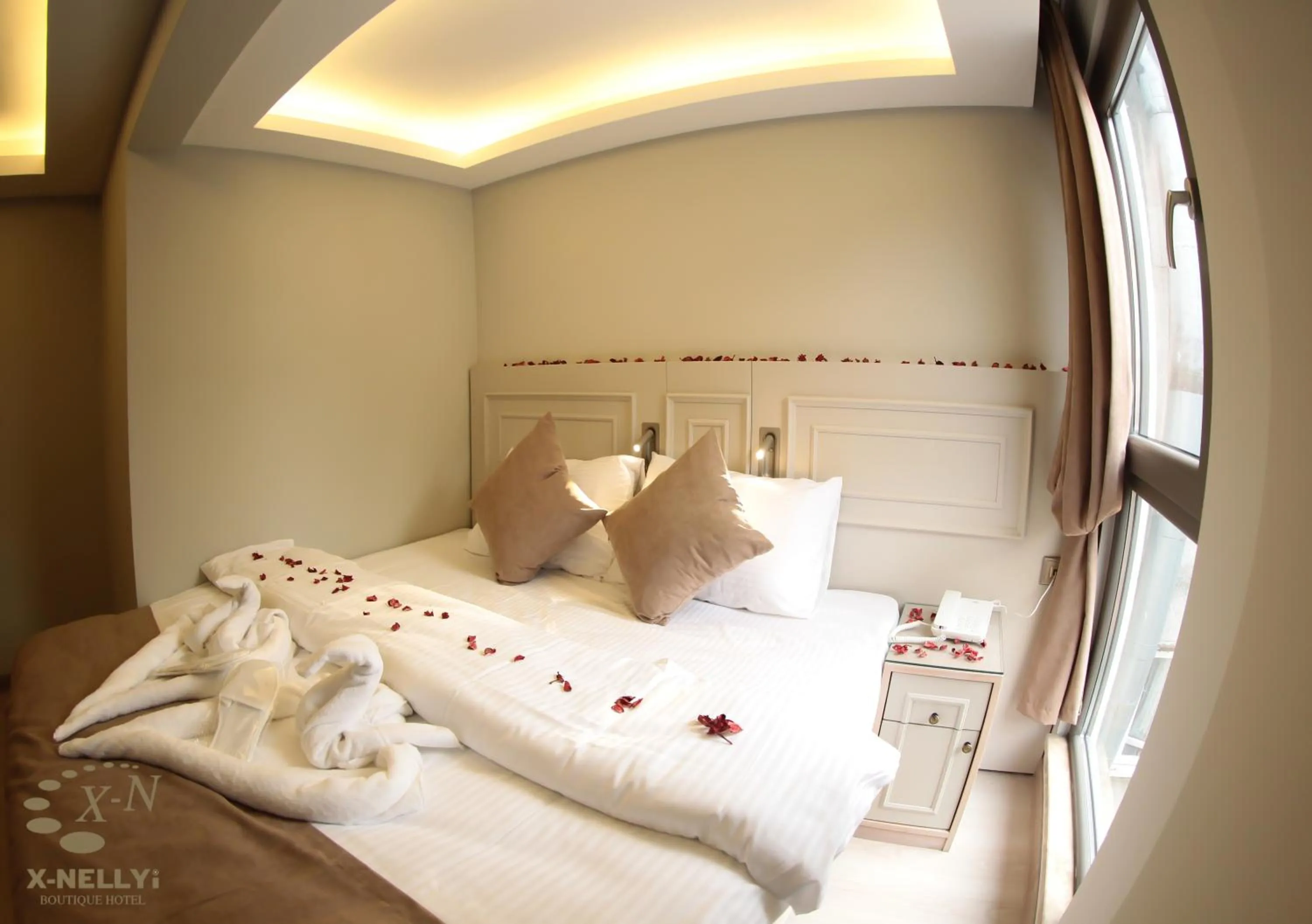 Bed in X-NELLYİ HOTEL