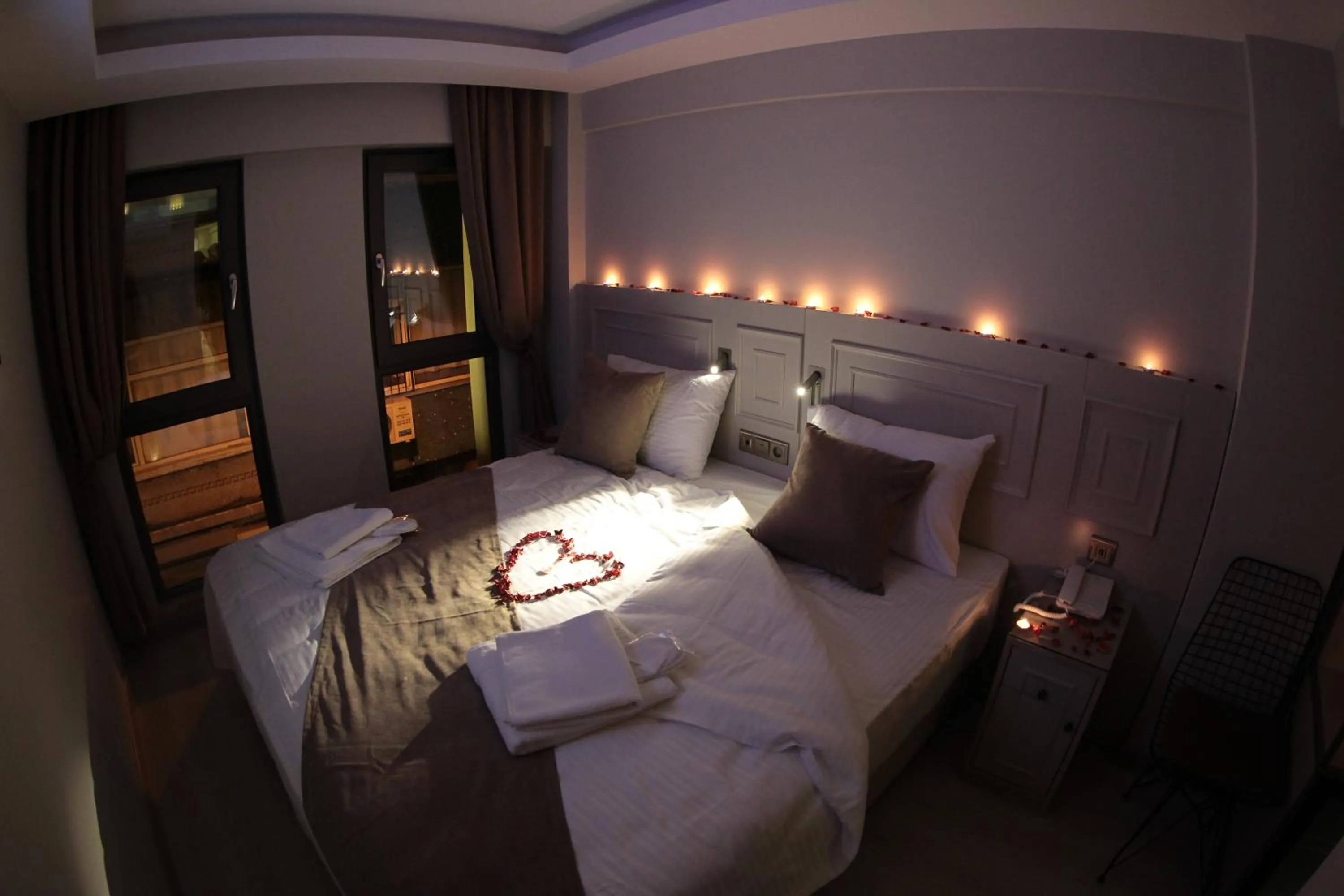 Bed in X-NELLYİ HOTEL