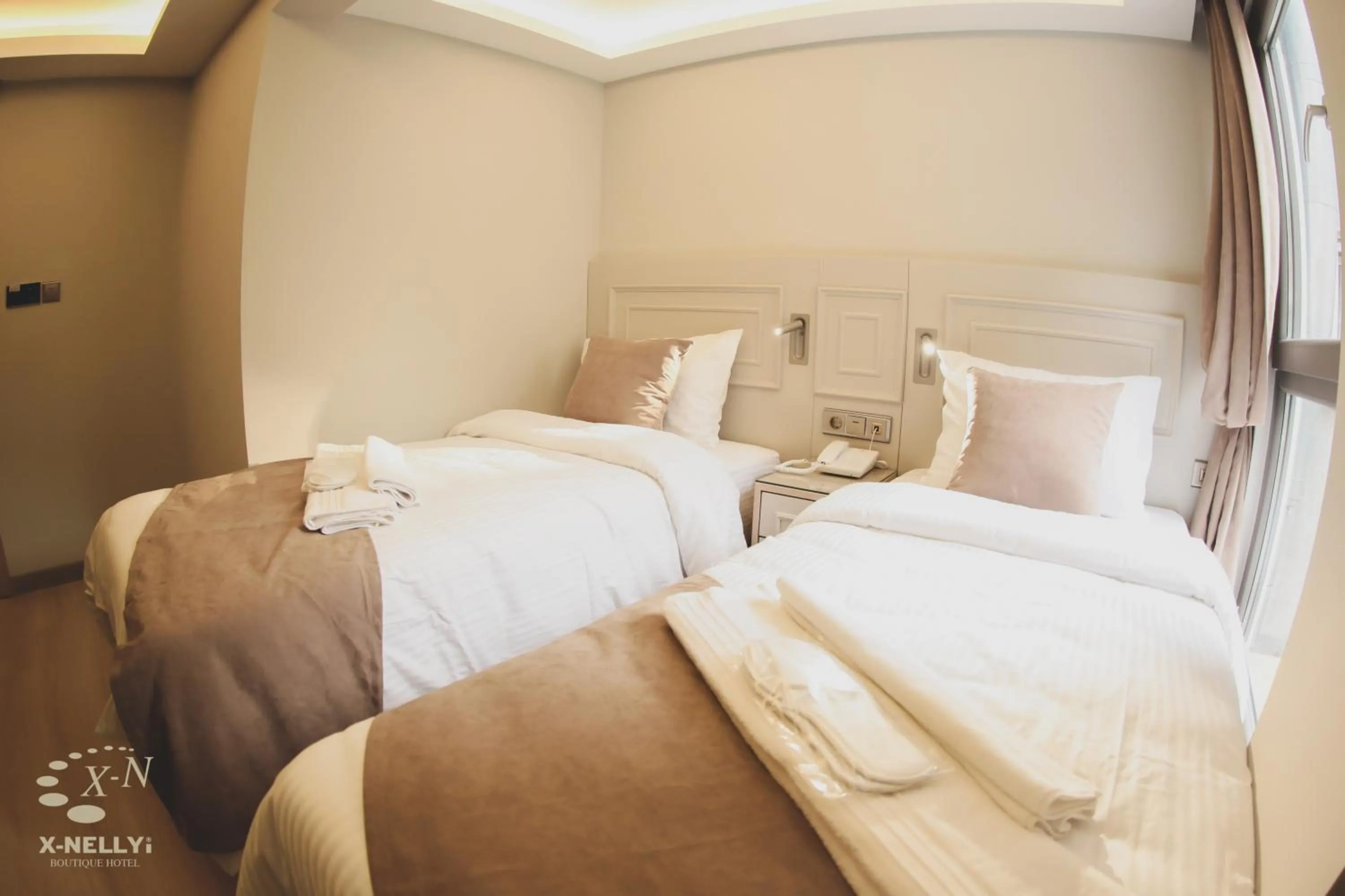 Bed in X-NELLYİ HOTEL