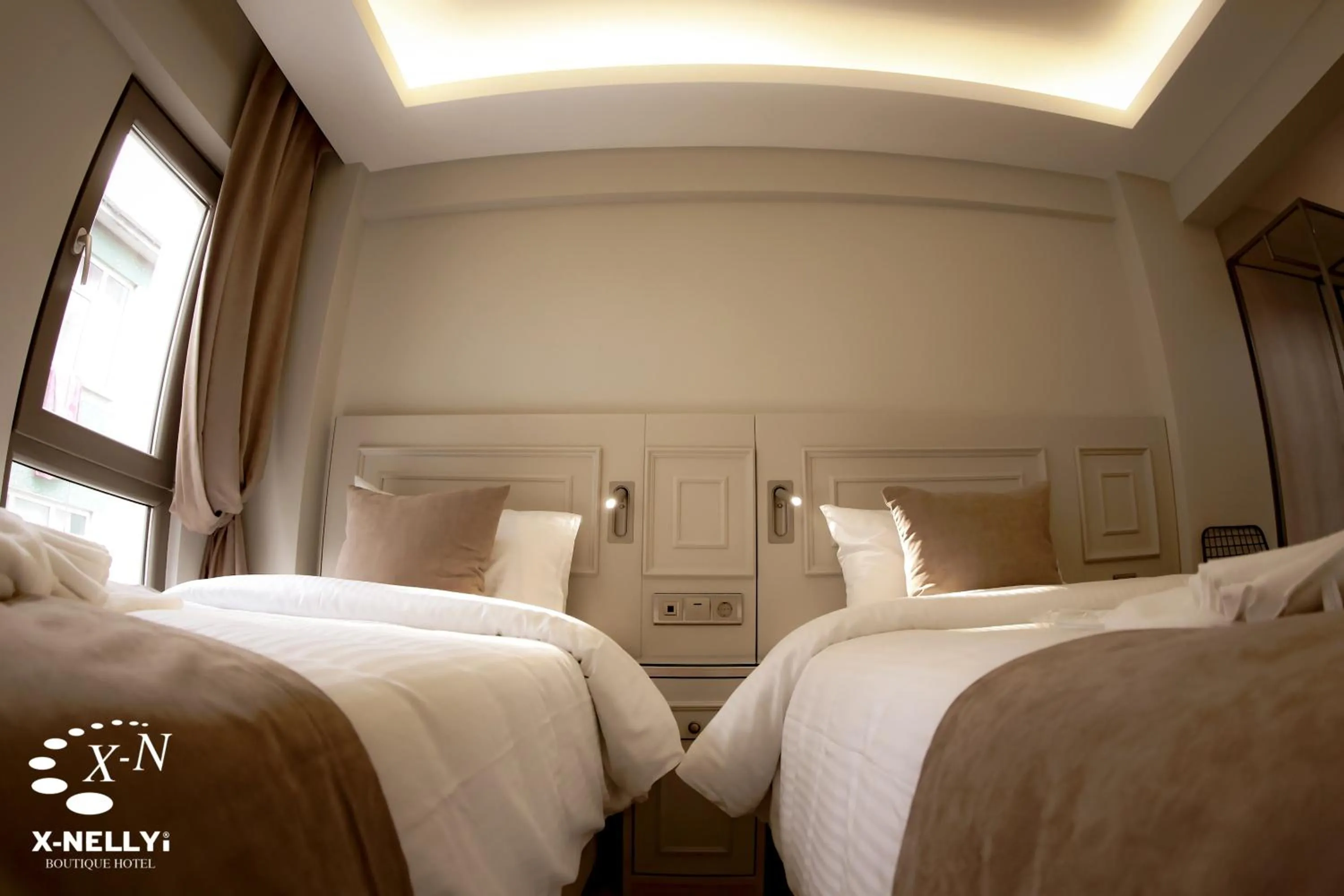 Bed in X-NELLYİ HOTEL
