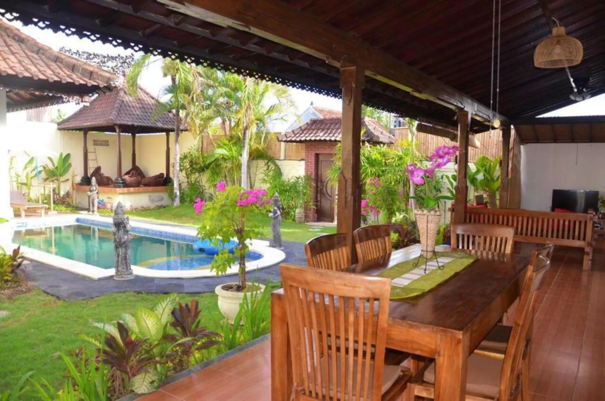 Communal lounge/ TV room in Tegal Uma Seminyak by Maha Bali