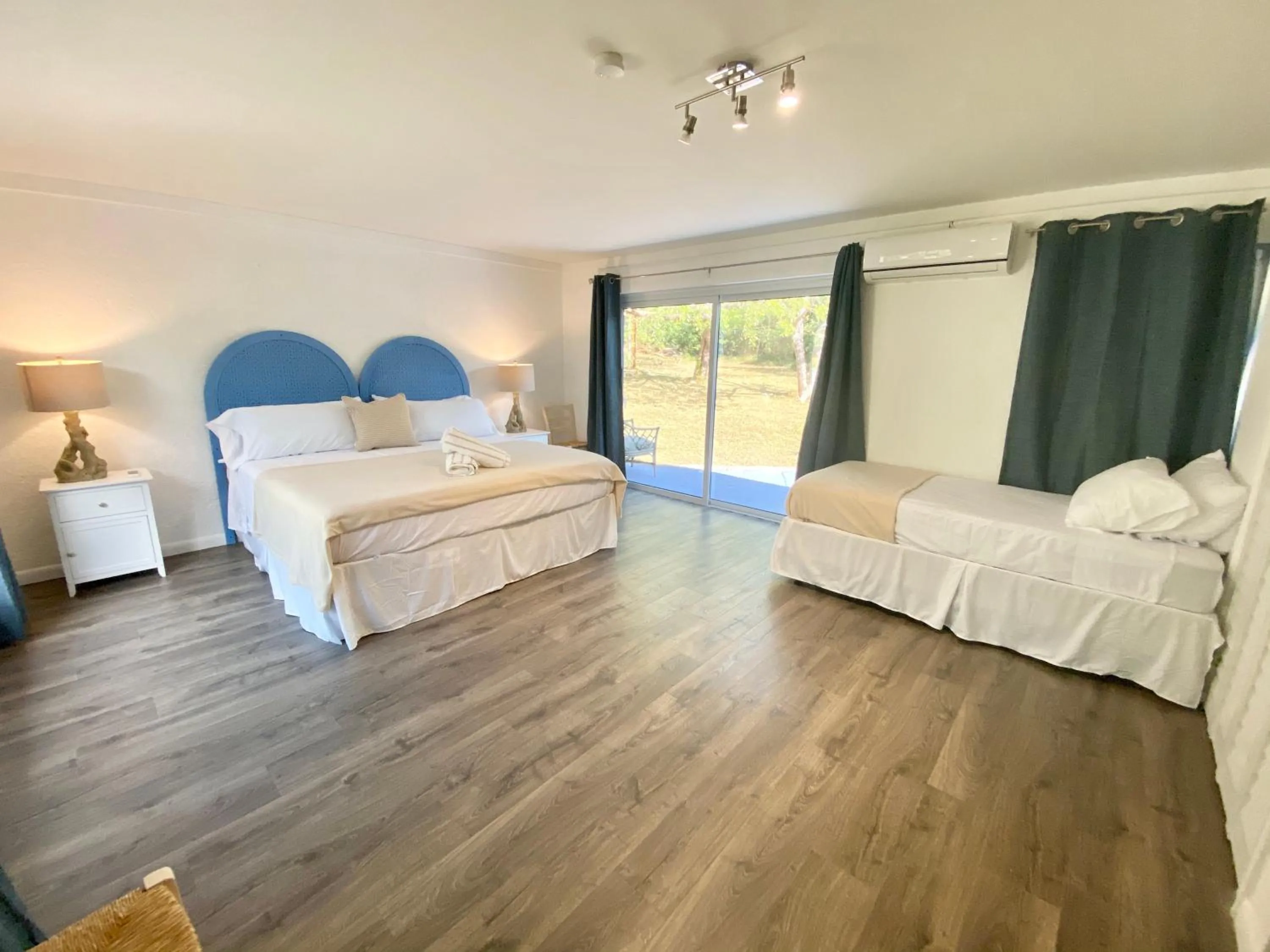 Bed in The Sunset Cove and Rainbow Room