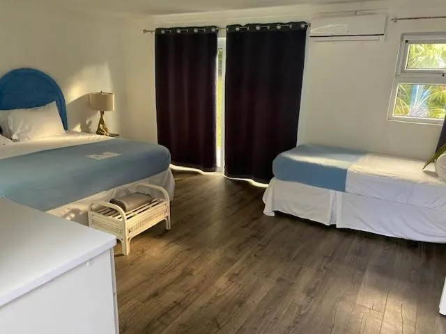 Bed in The Sunset Cove and Rainbow Room