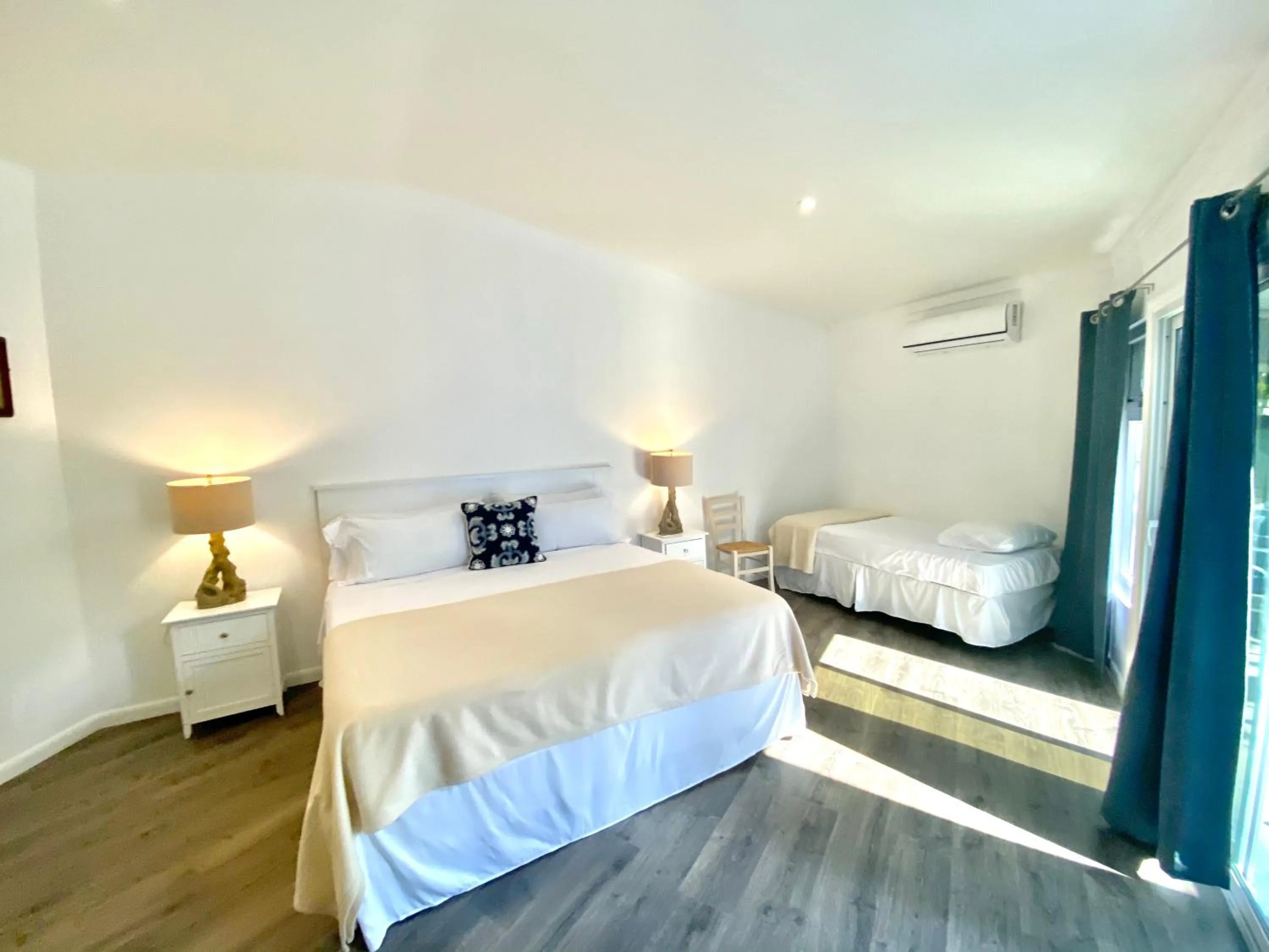 Bed in The Sunset Cove and Rainbow Room