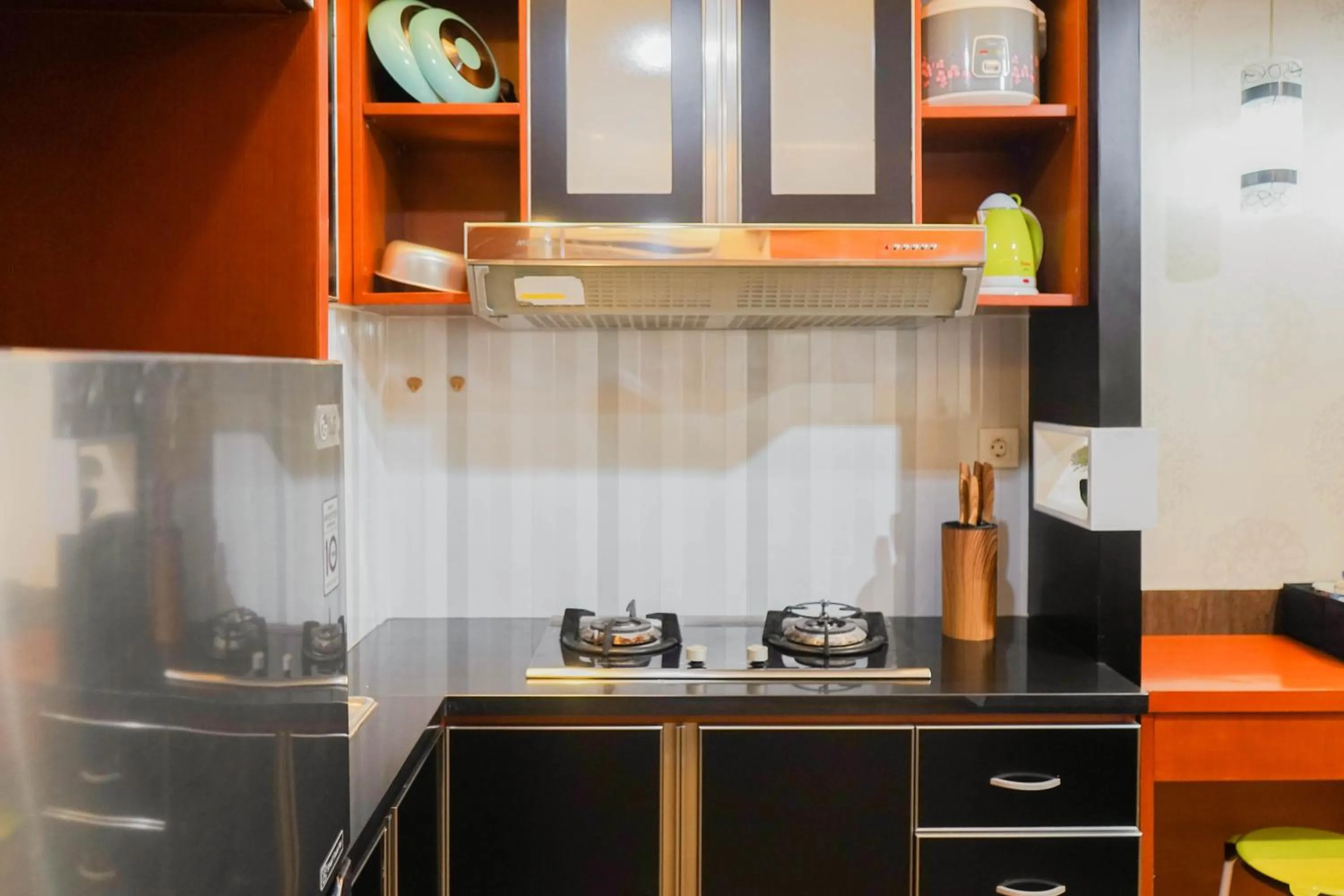 Kitchen or kitchenette in Best Price 2BR at Tifolia Apartment By Travelio