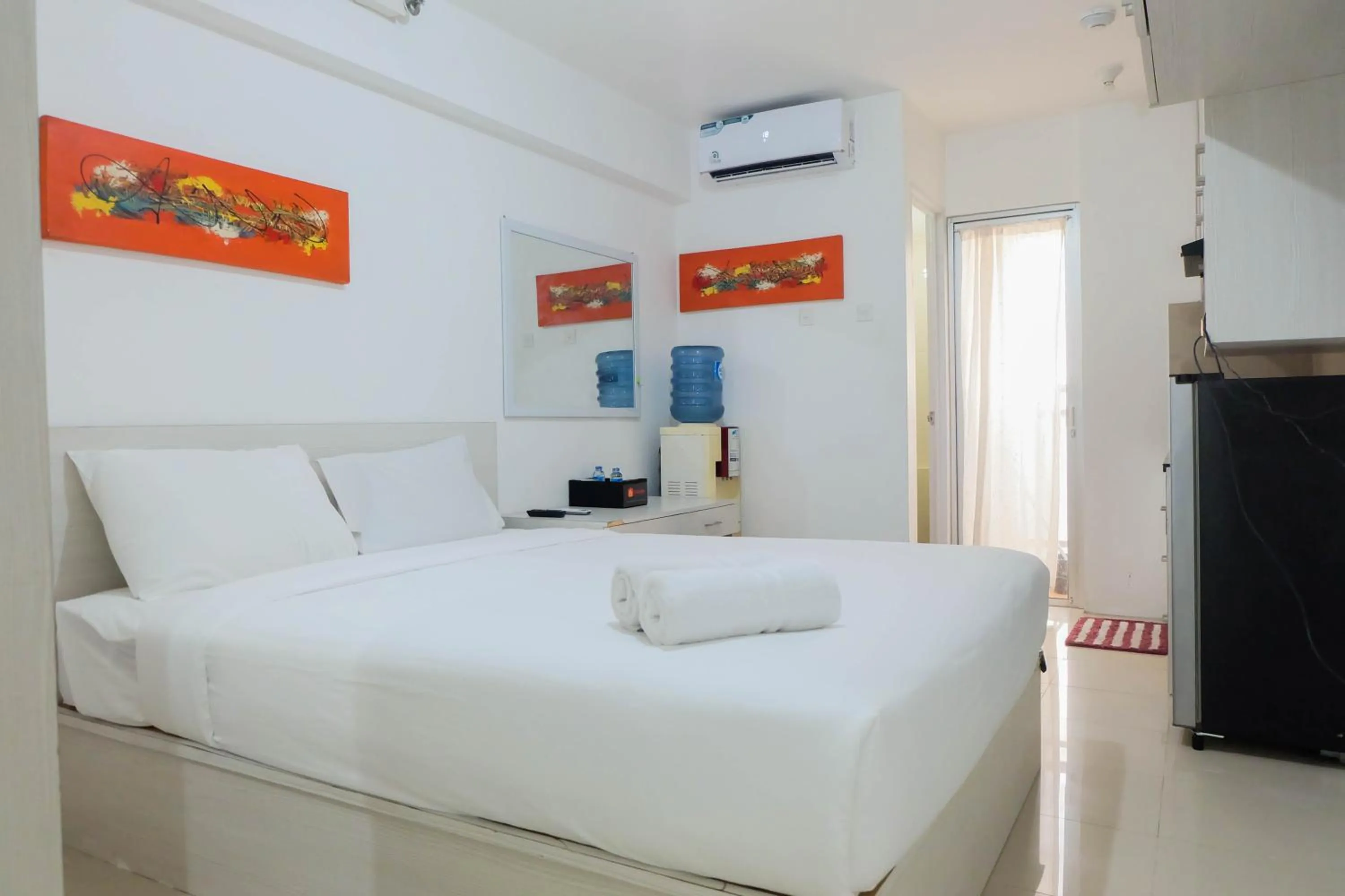 Bed in Tidy Studio Apartment at Bassura City near Shopping Mall By Travelio