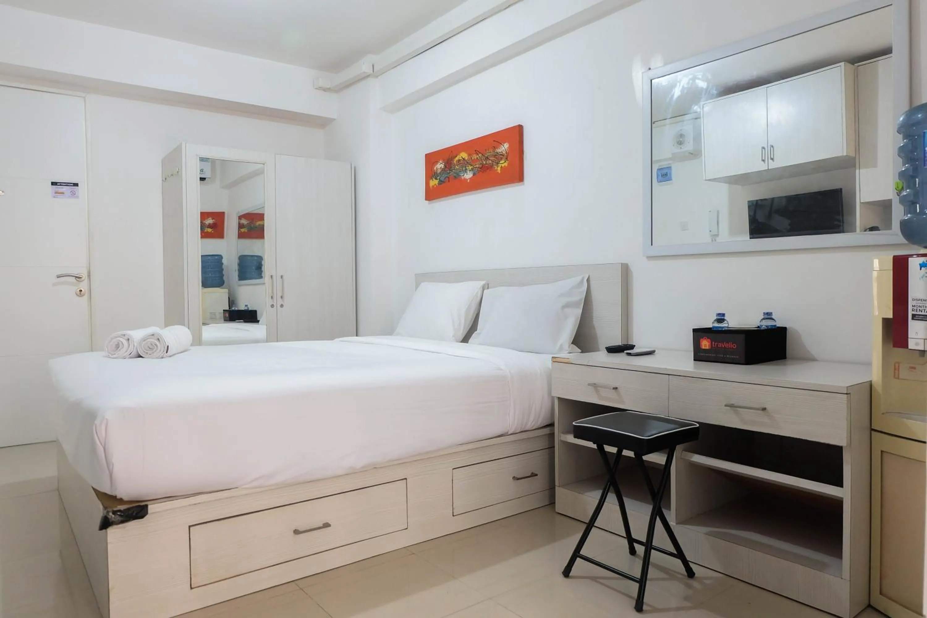 Bed in Tidy Studio Apartment at Bassura City near Shopping Mall By Travelio