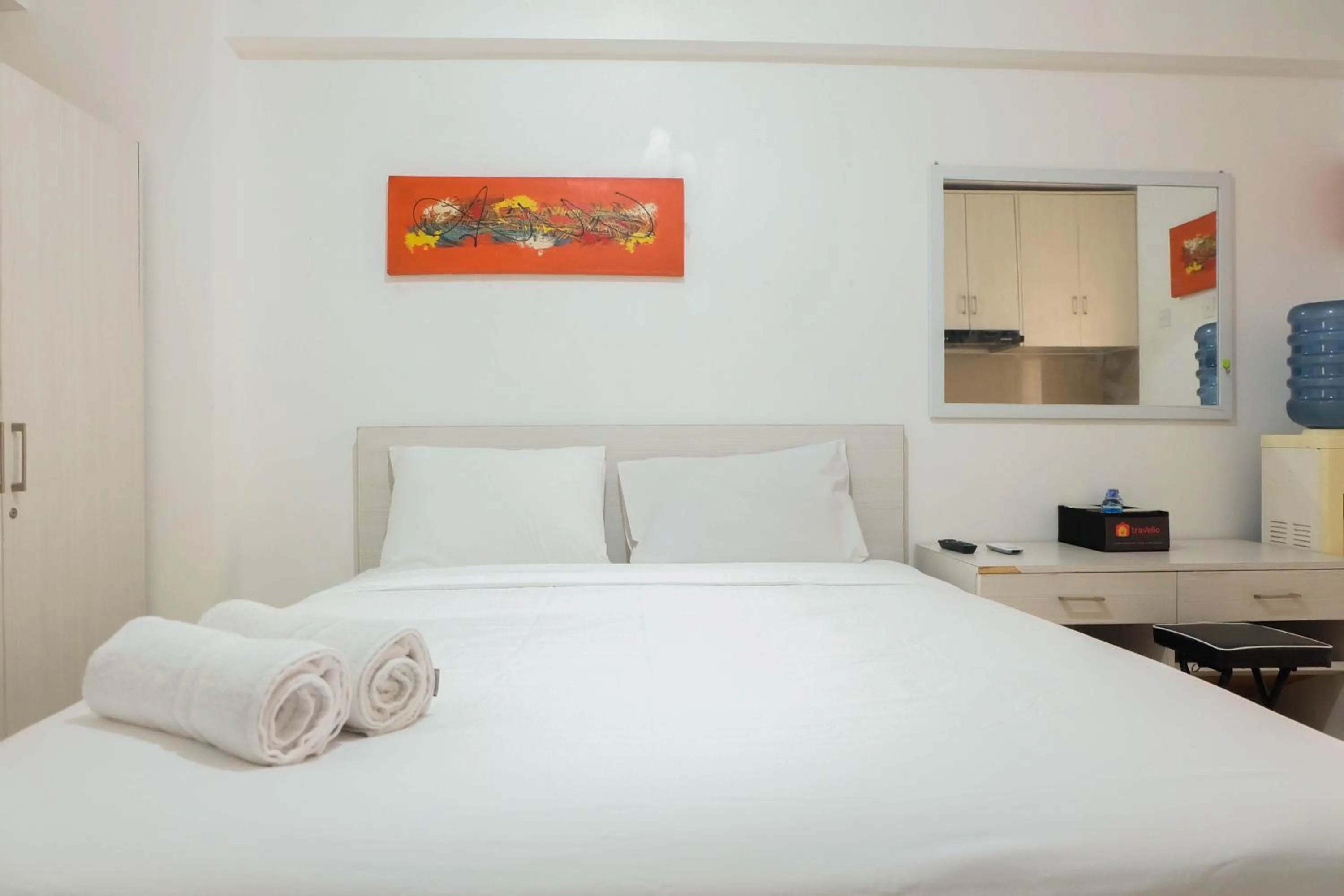 Bed in Tidy Studio Apartment at Bassura City near Shopping Mall By Travelio