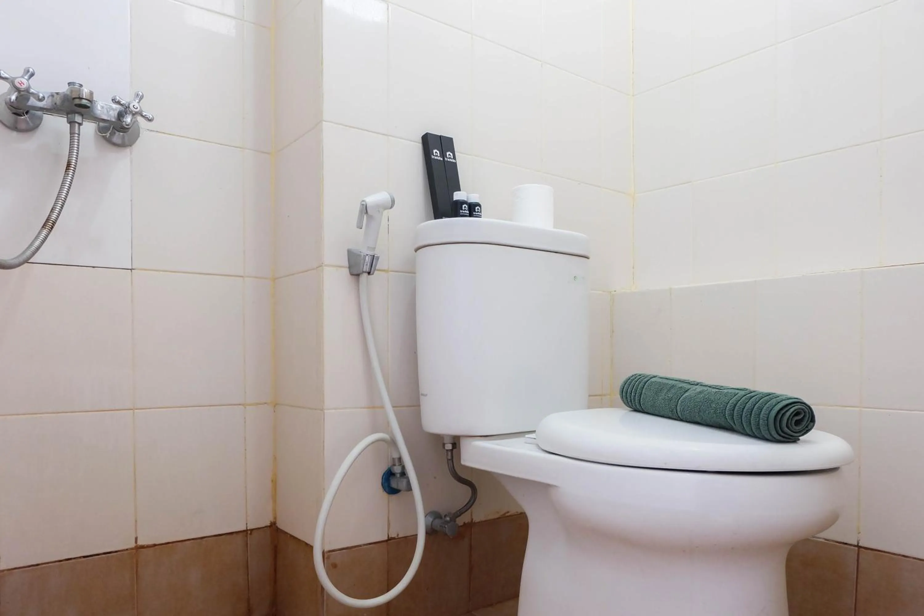 Bathroom in Tidy Studio Apartment at Bassura City near Shopping Mall By Travelio