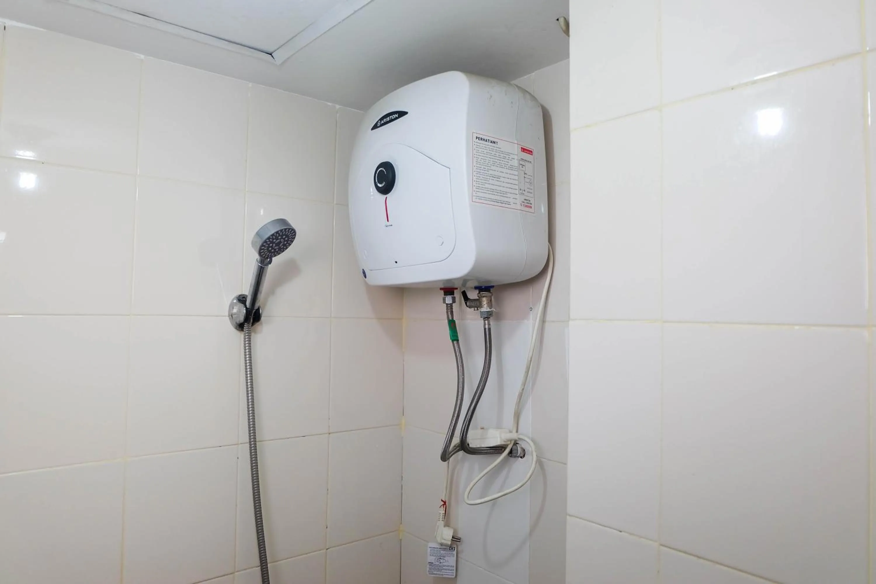 Bathroom in Tidy Studio Apartment at Bassura City near Shopping Mall By Travelio