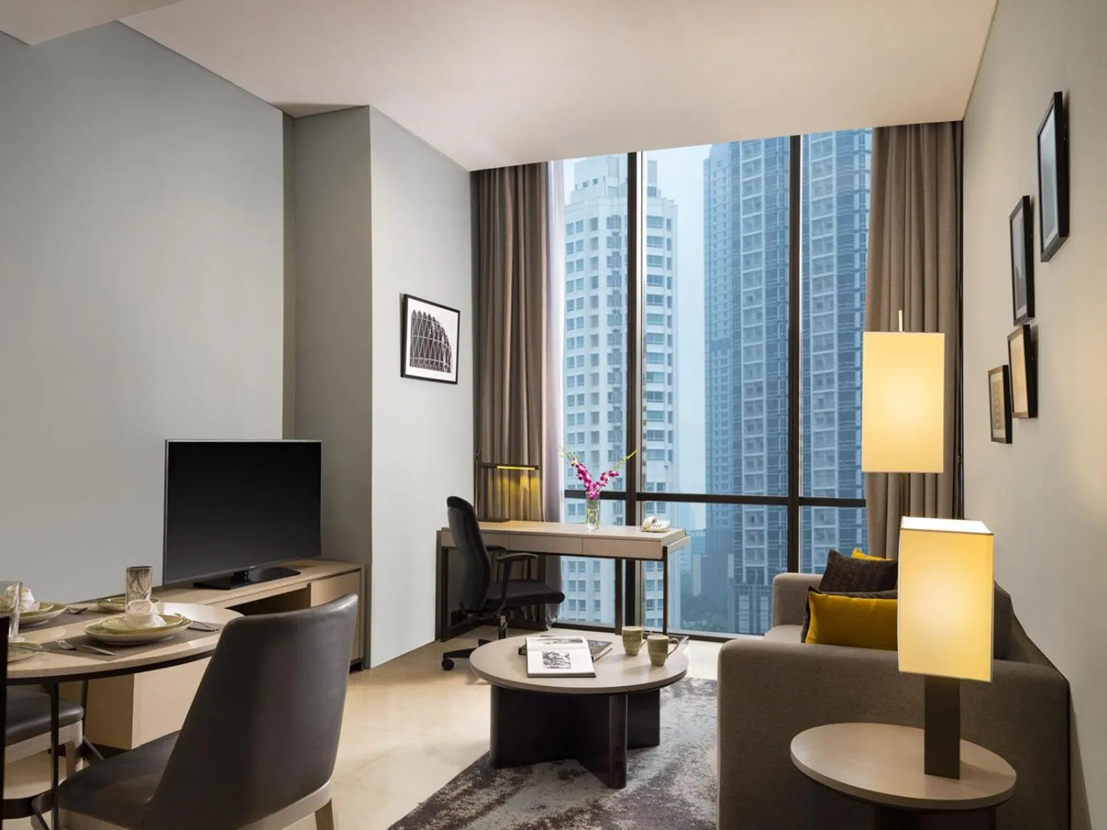 Communal lounge/ TV room in Mangkuluhur Residences by Lorin