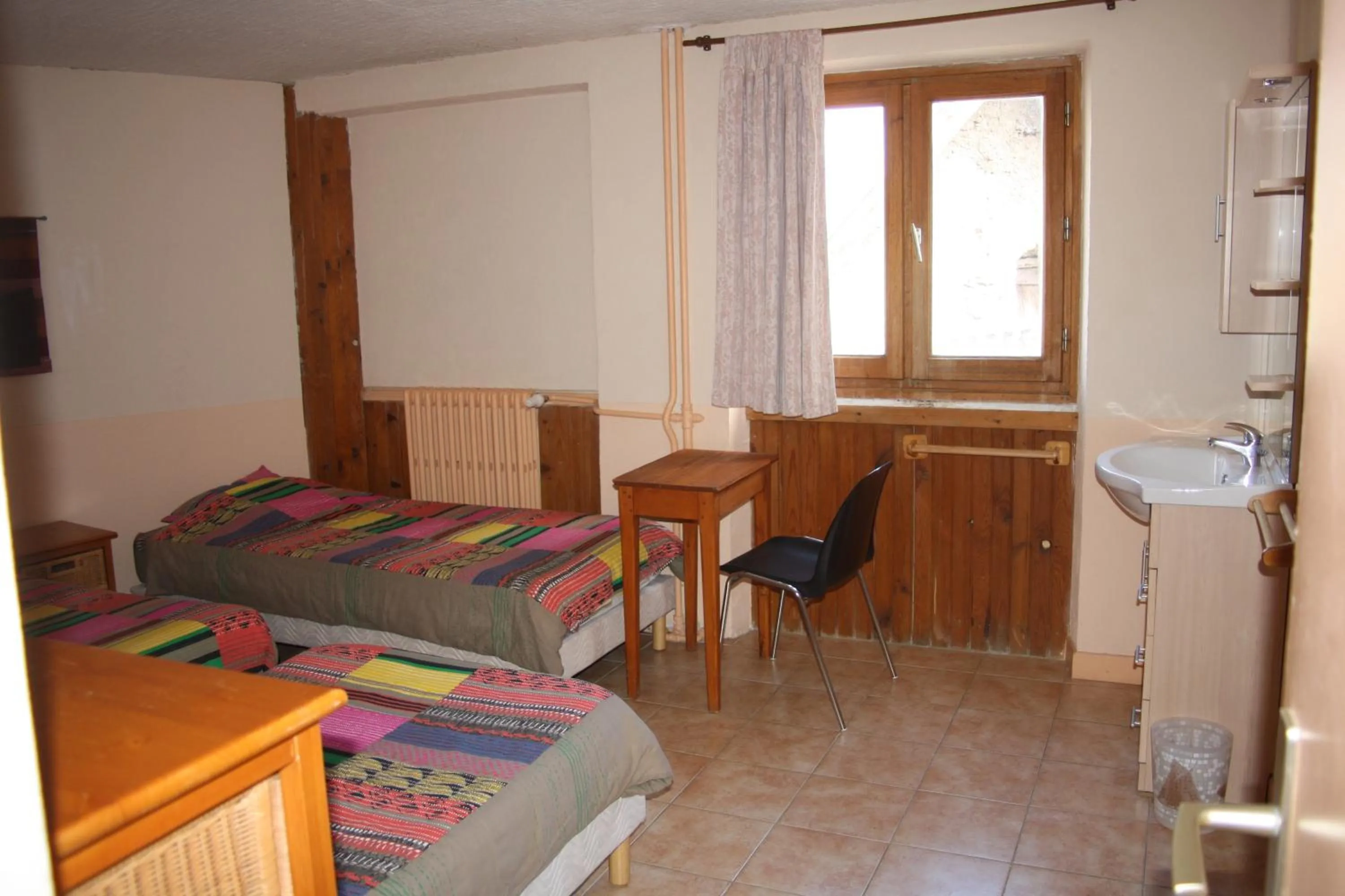 Bed in LE GÎTE LES MELEZES