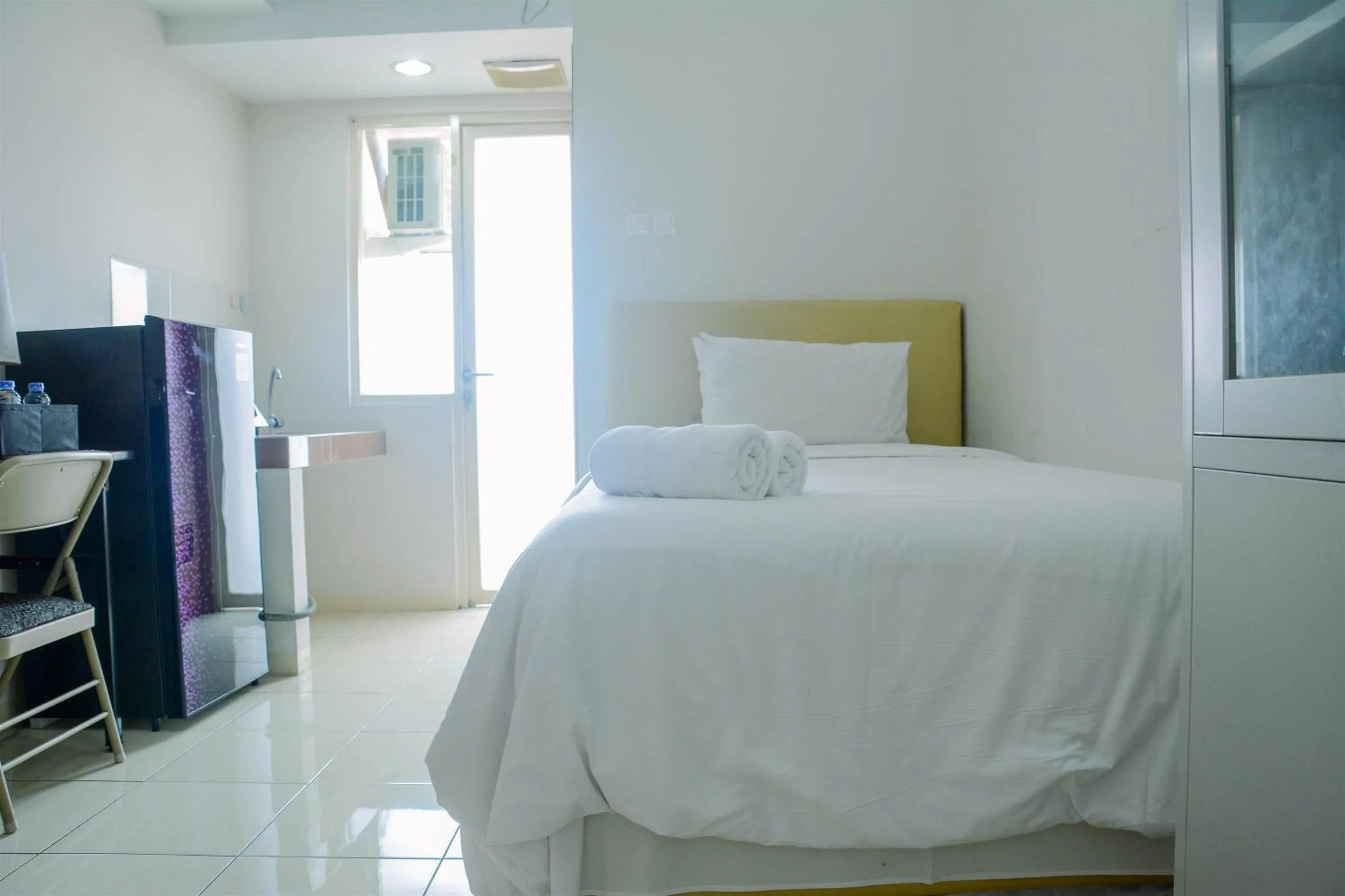 Bed in Cozy Studio Apartment at Margonda Residence 4 By Travelio