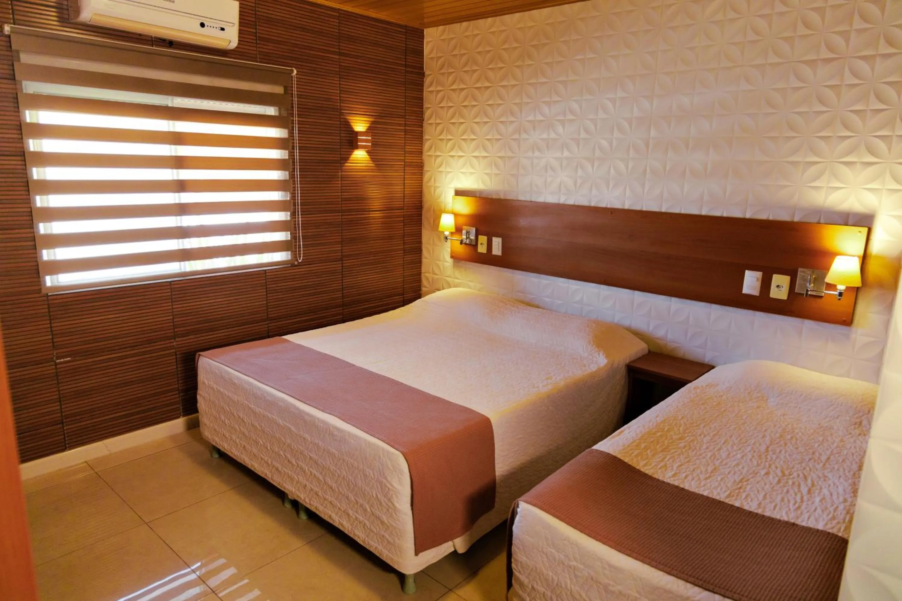 Bed in Pousada Costa Doce