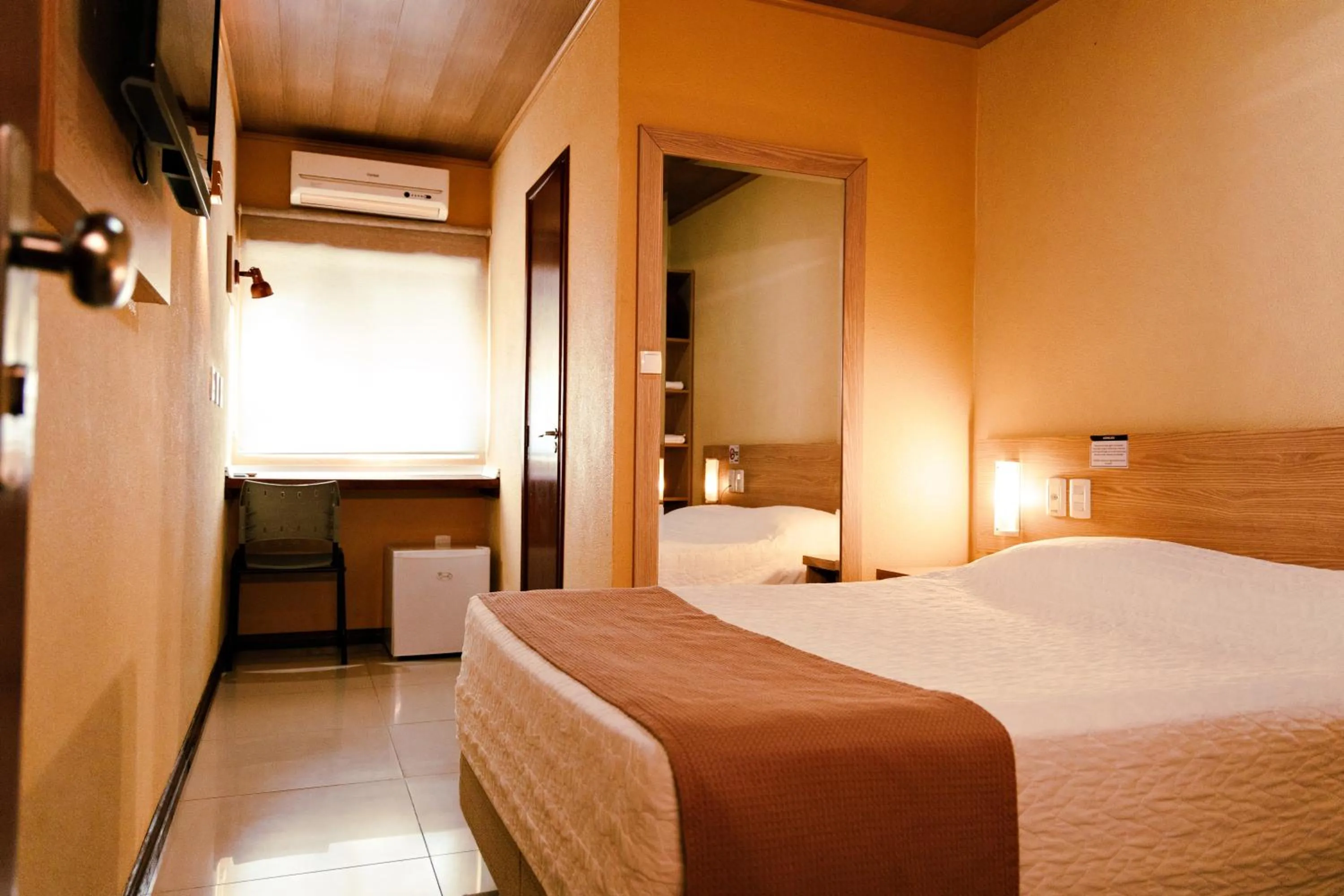 Bed in Pousada Costa Doce