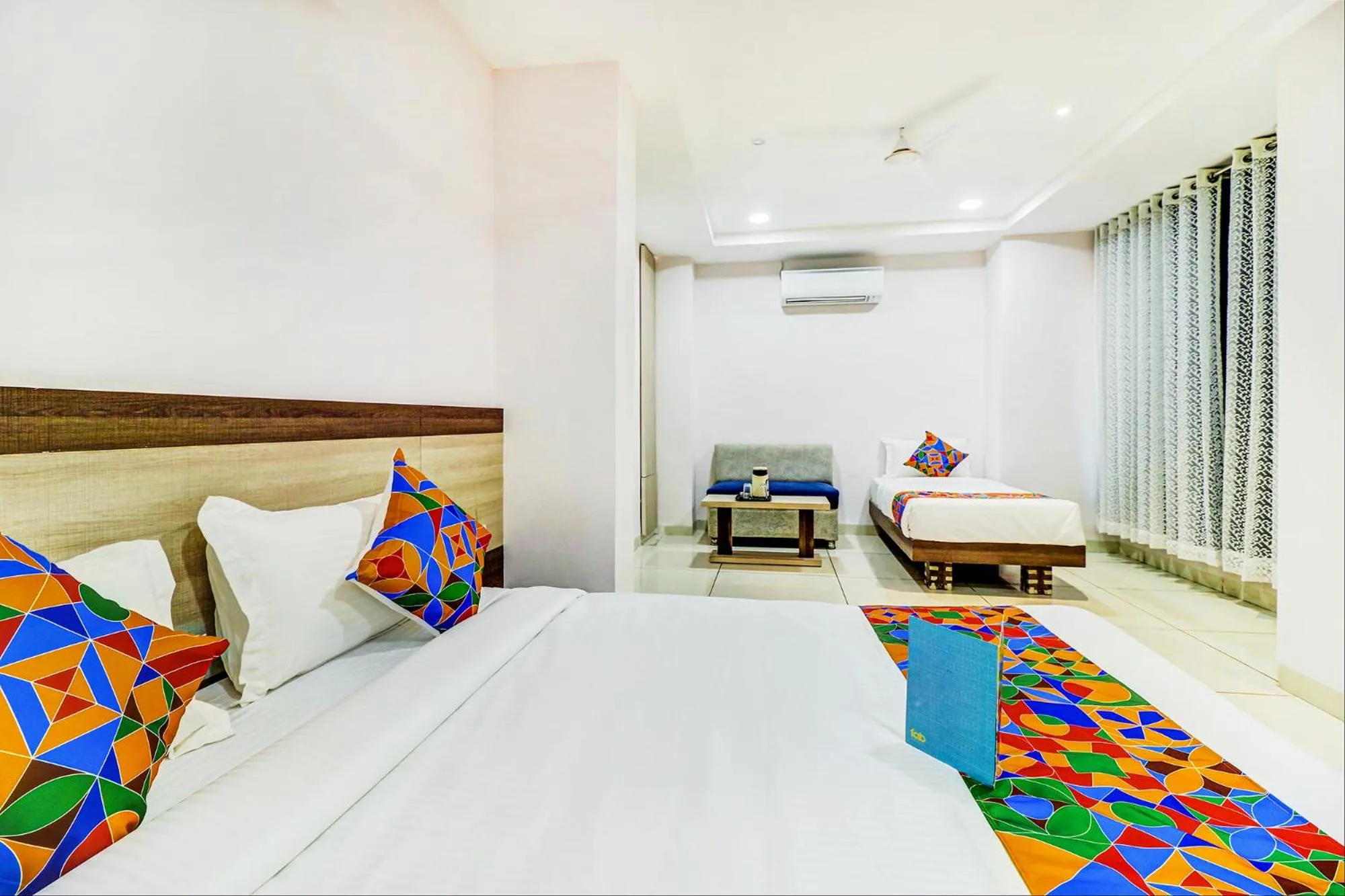 Bed in FabHotel Meera Palace