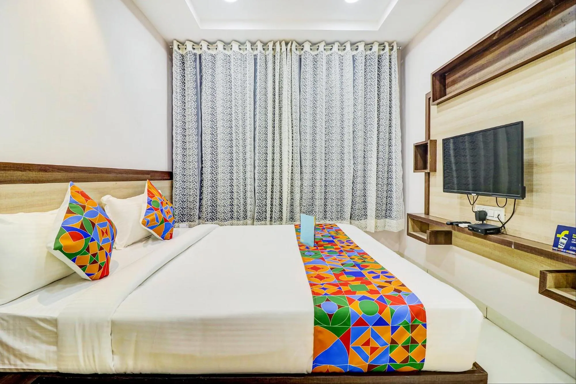 Bed in FabHotel Meera Palace