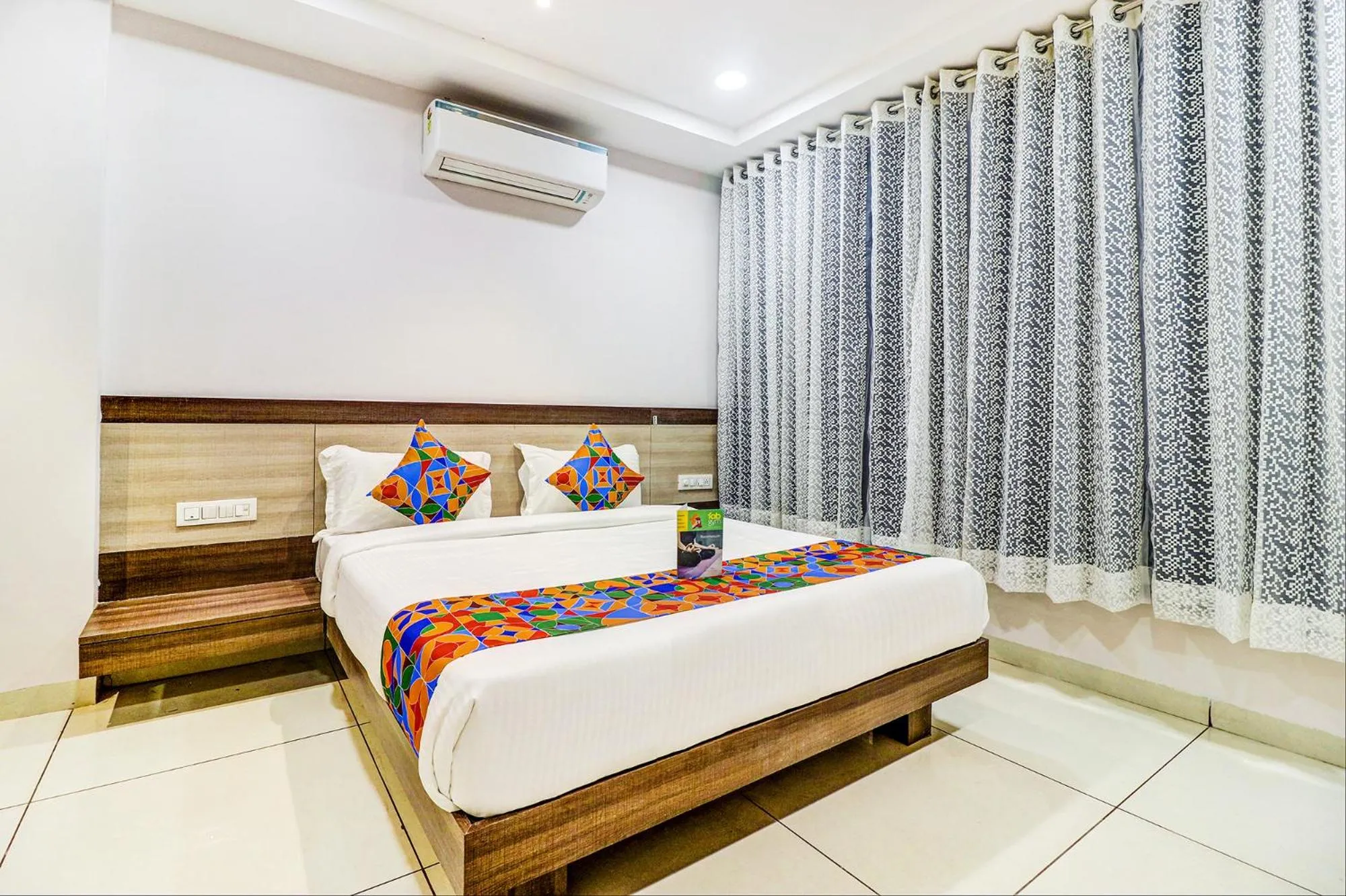 Bed in FabHotel Meera Palace