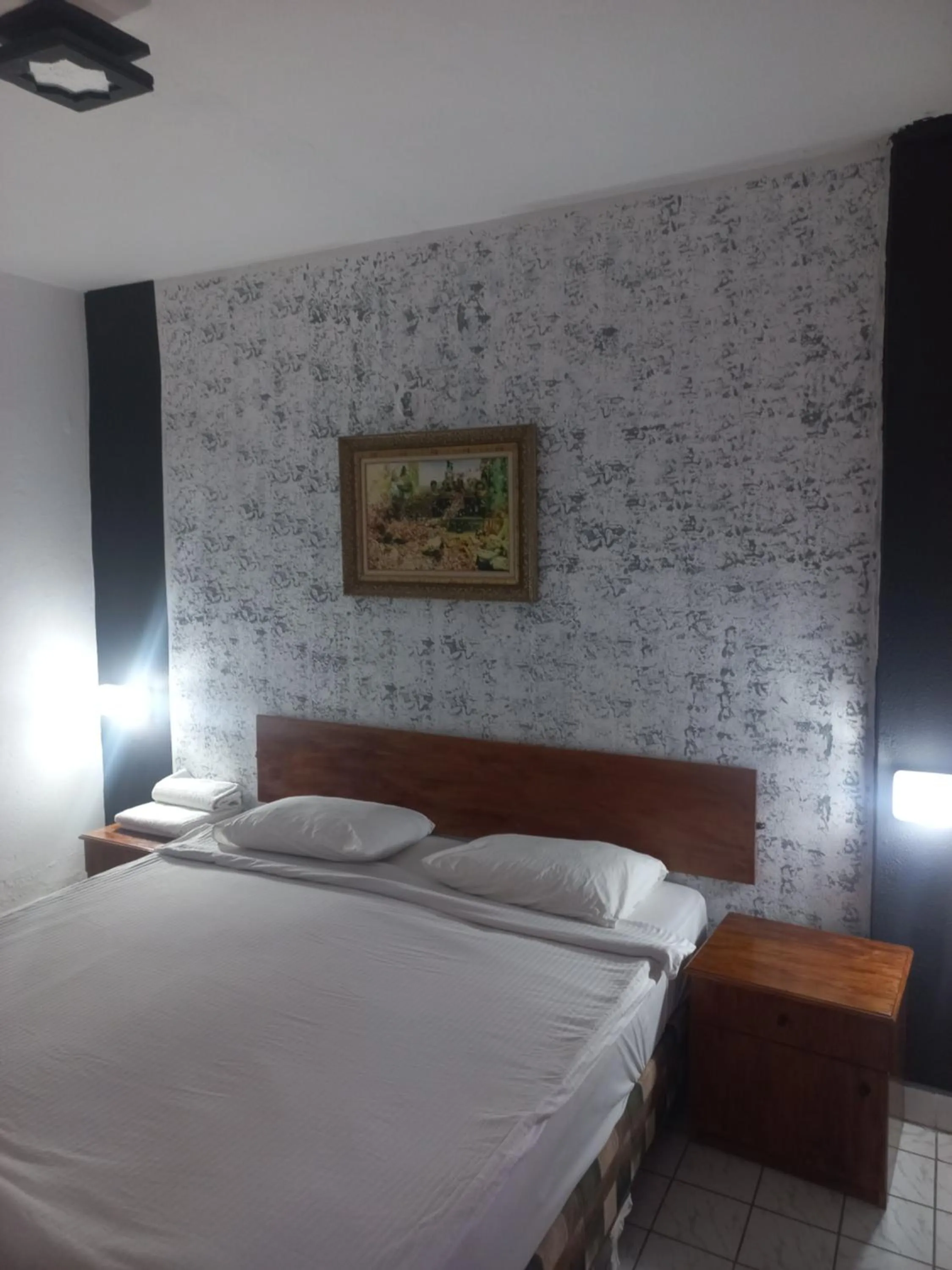 Bed in Delphin Apart Hotel