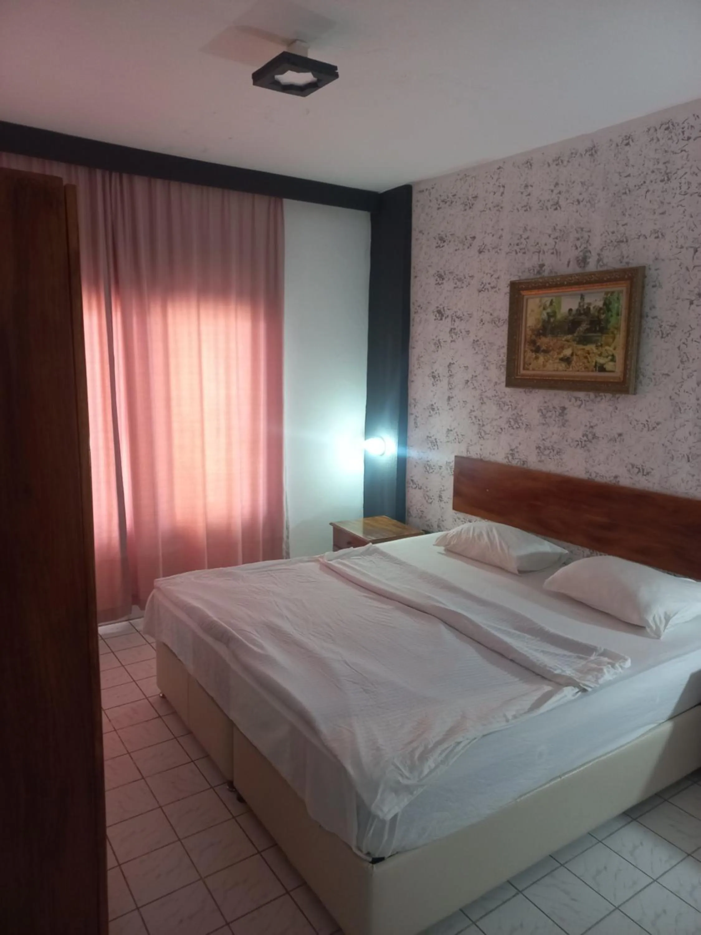 Bed in Delphin Apart Hotel