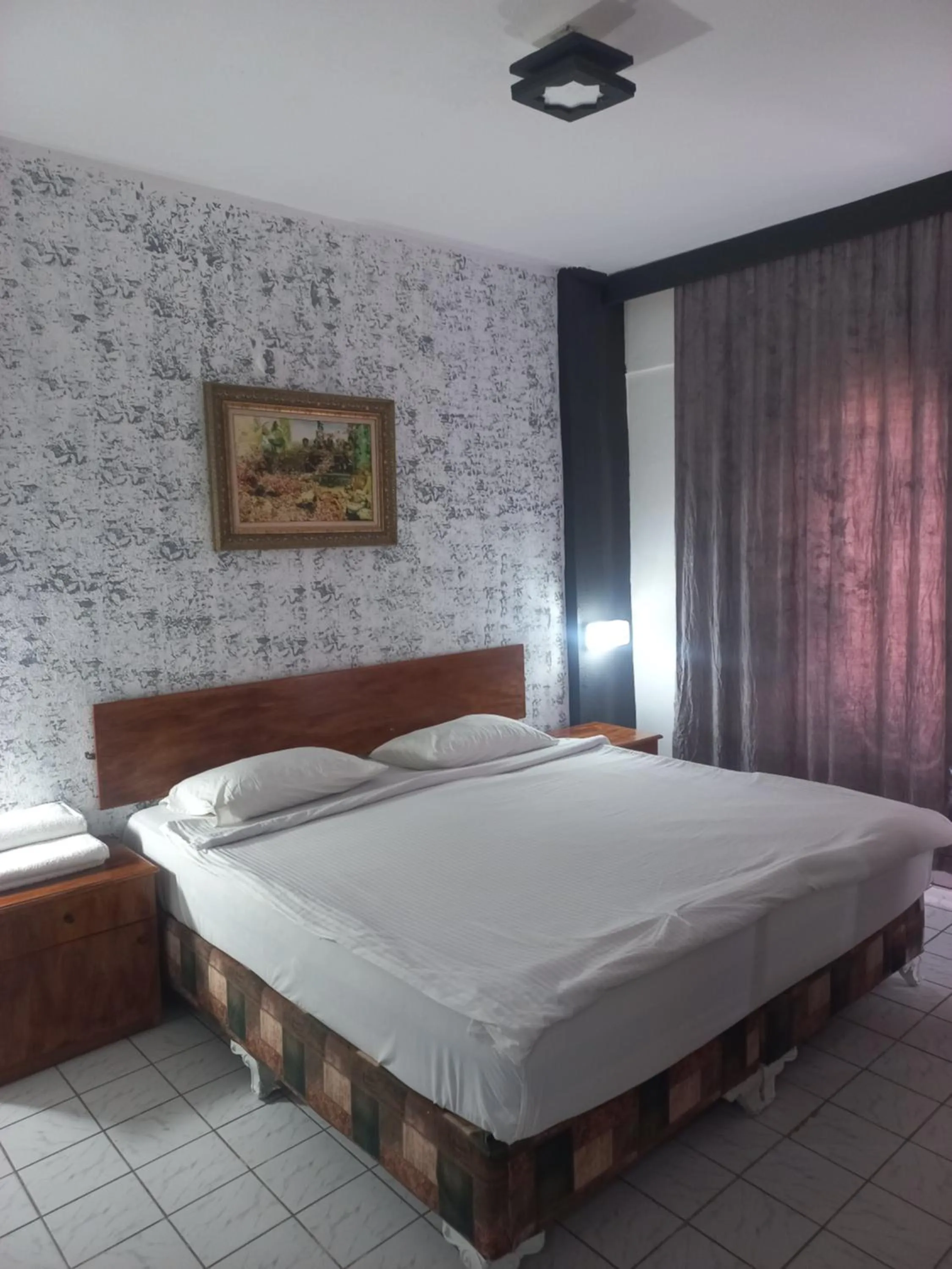 Bed in Delphin Apart Hotel