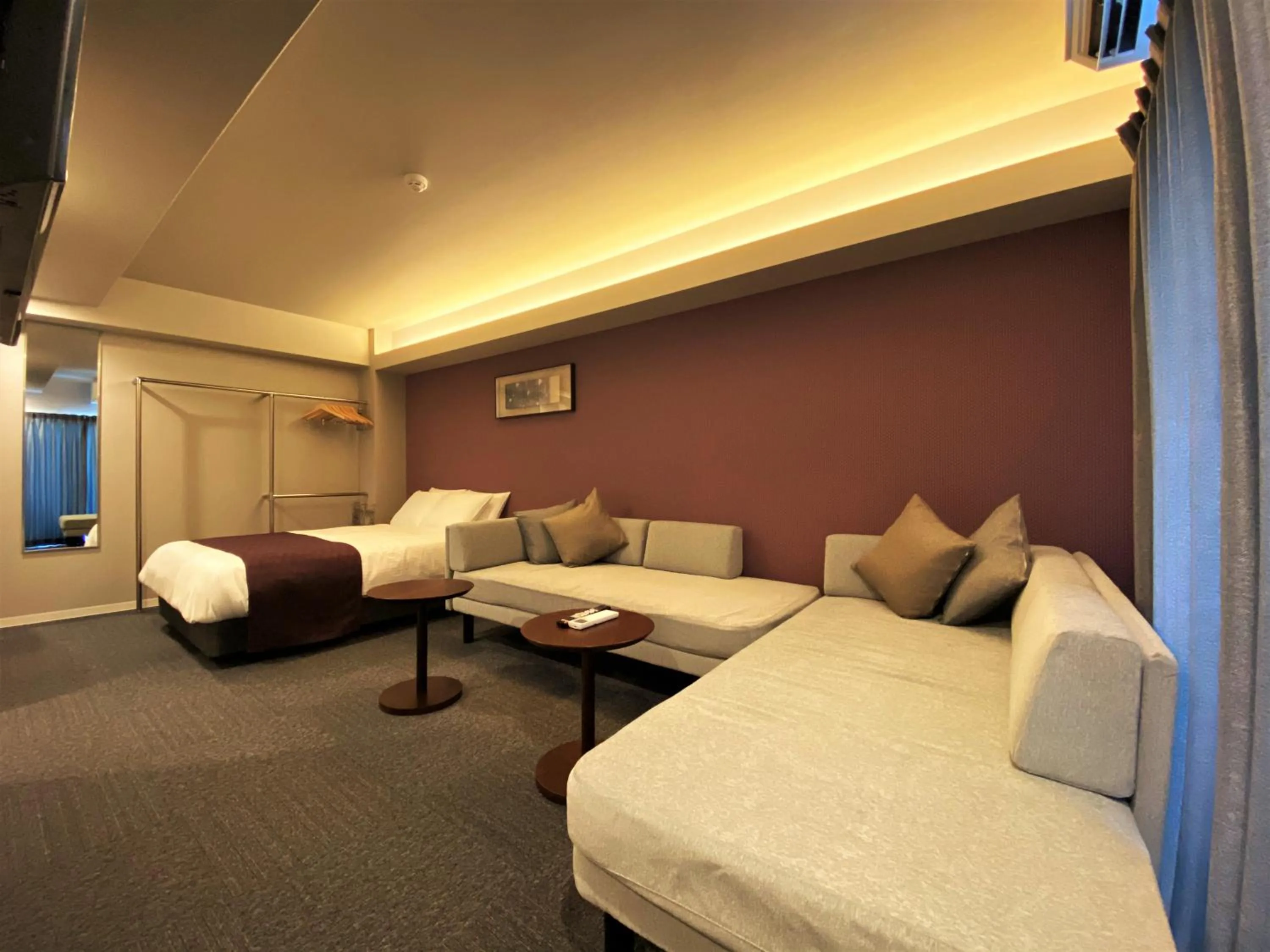 Living room, Bed in Randor Residential Hotel Fukuoka Annex
