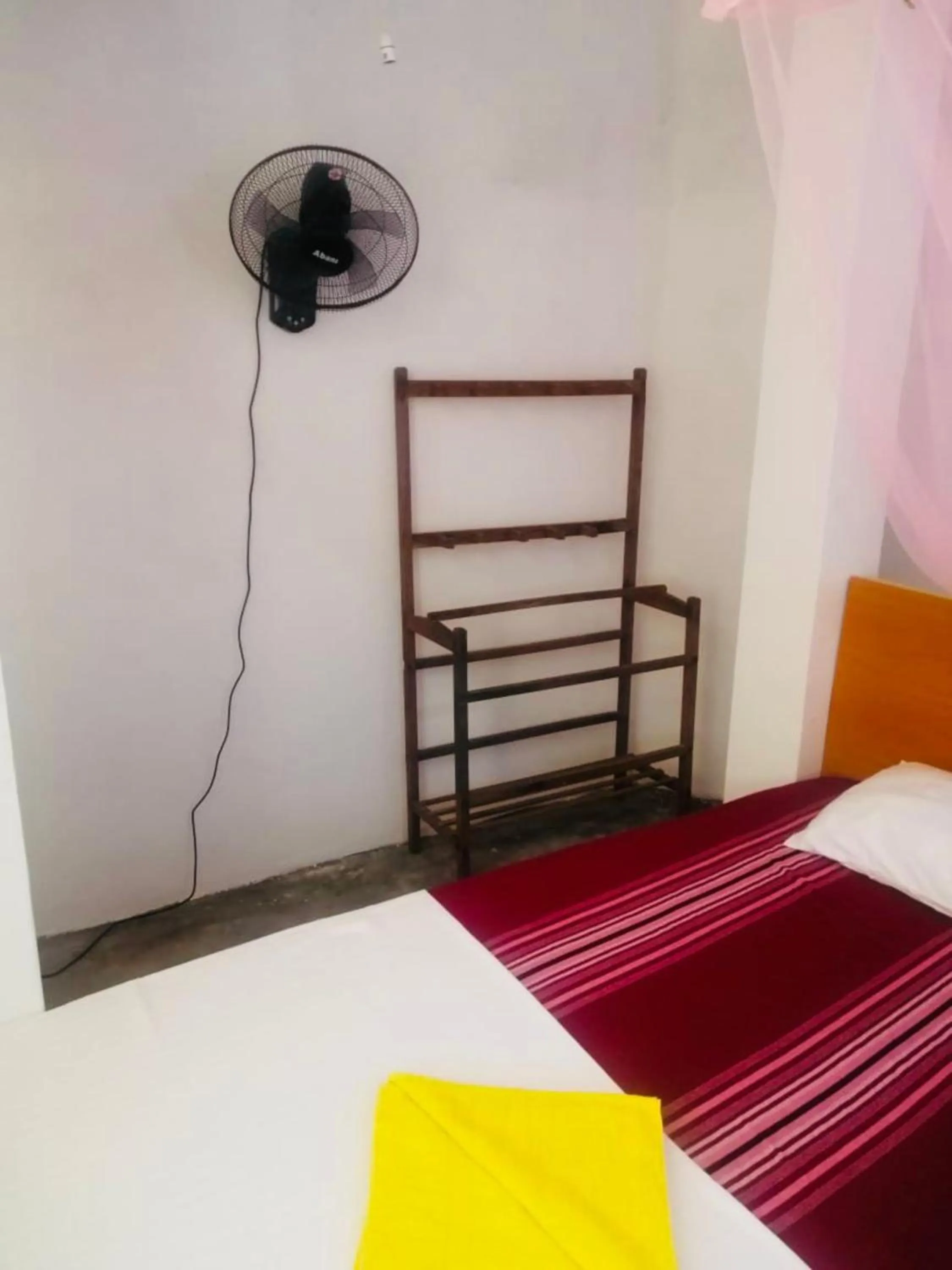 Bed in Hiriketiya Orchid Villa