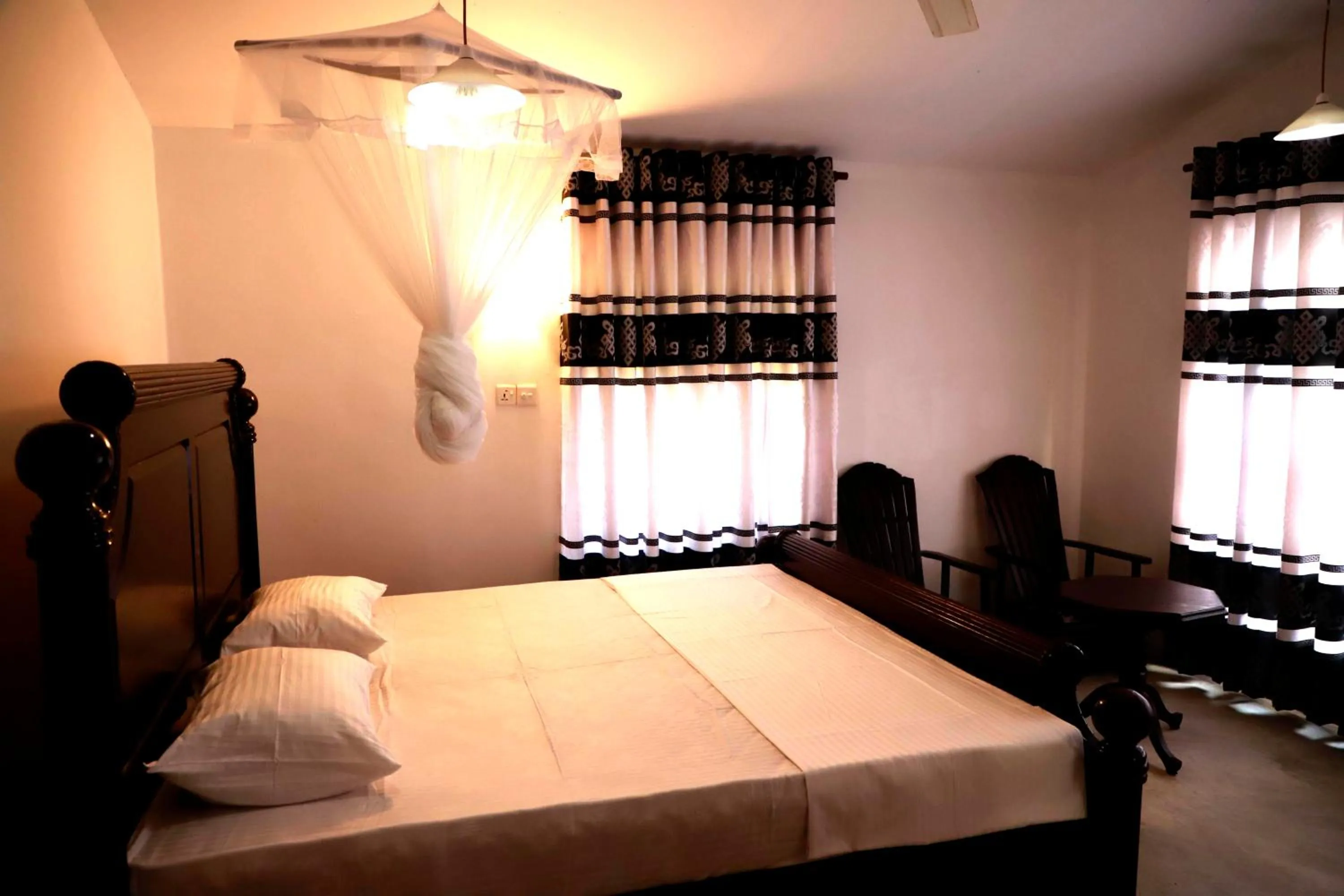 Bed in Hiriketiya Orchid Villa