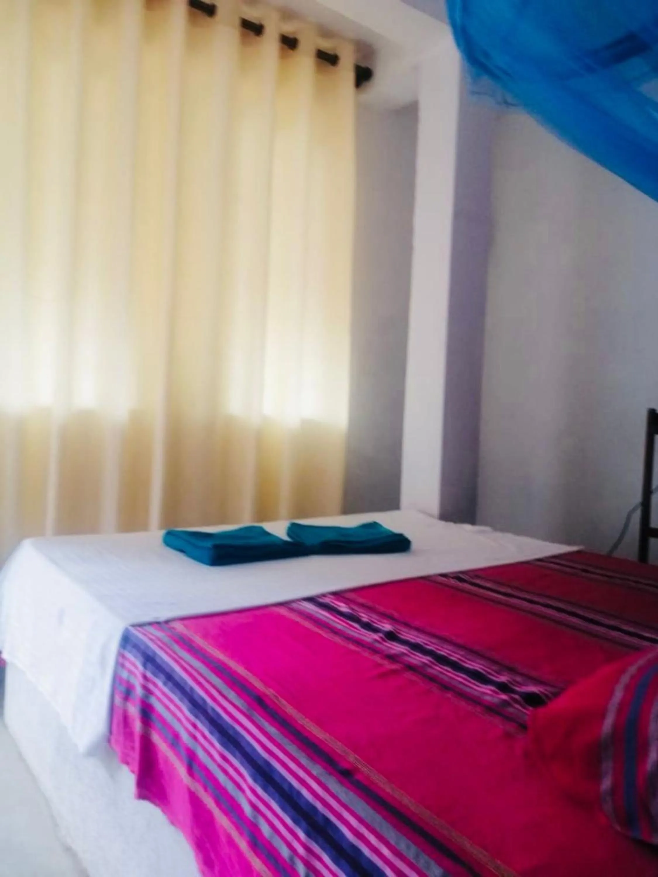 Bed in Hiriketiya Orchid Villa