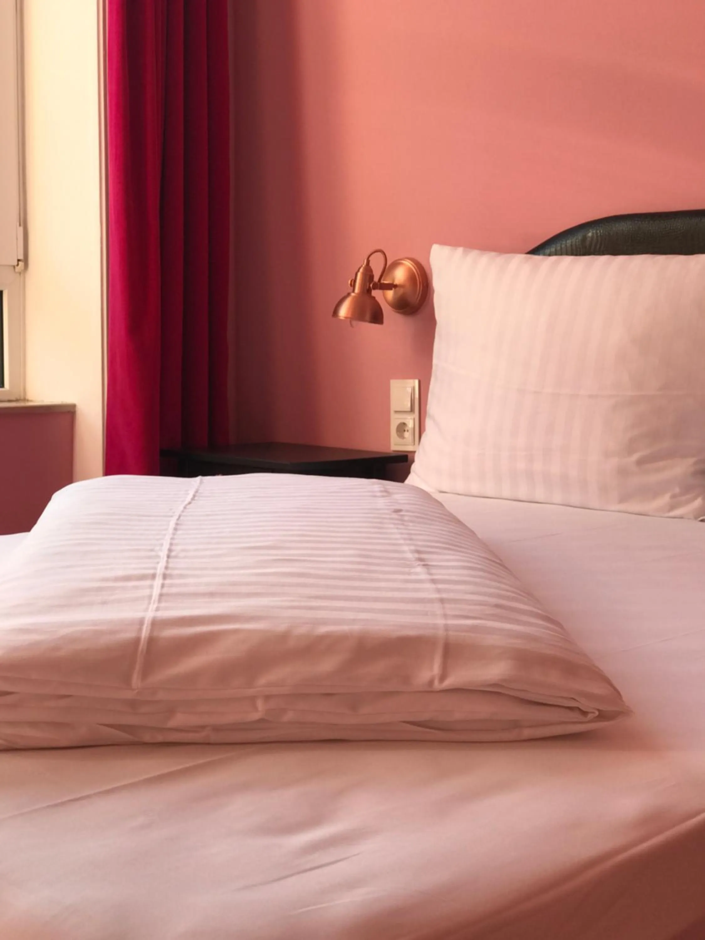 Bed in SmartHotel Mystique Self check-in