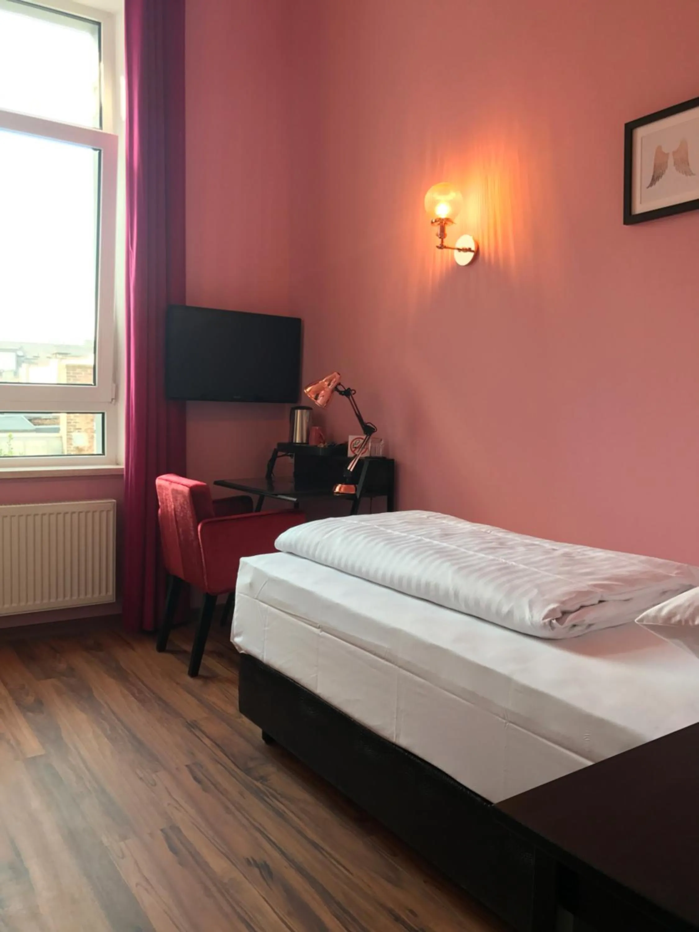 Bed in SmartHotel Mystique Self check-in