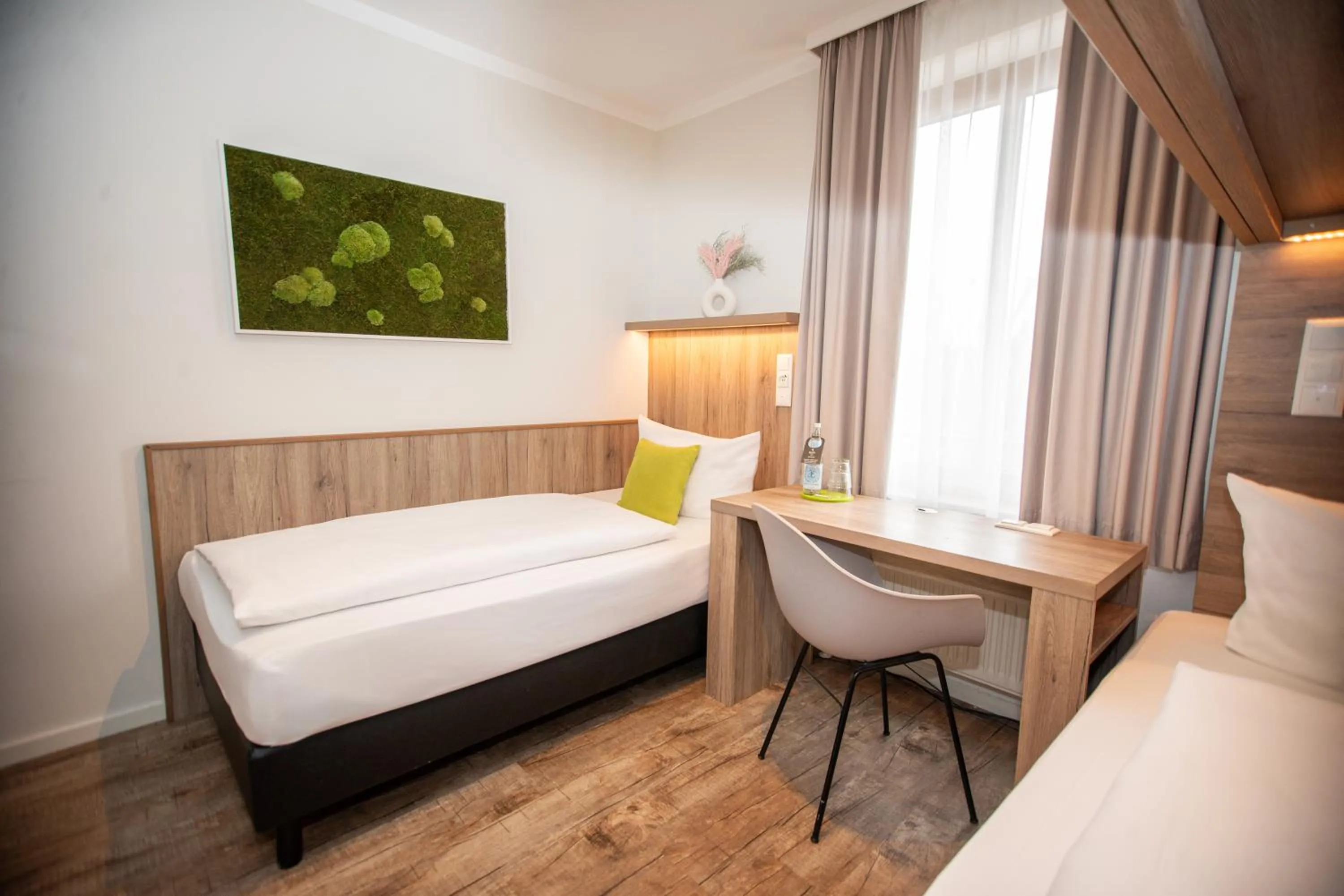 Decorative detail, Bed in Hotel Perlach Allee by Blattl