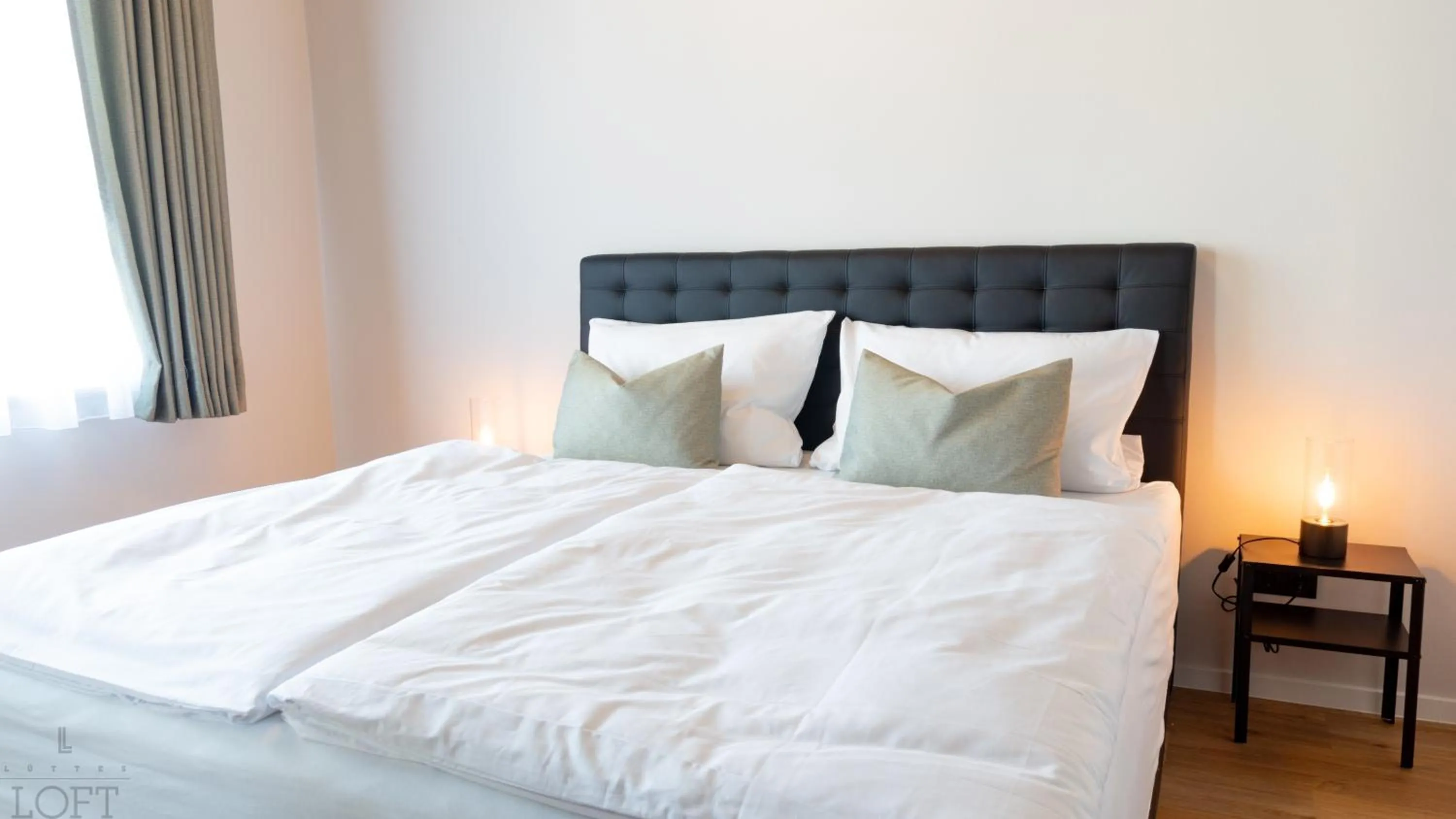 Bed in LÜTTES LOFT Boutique Hotel