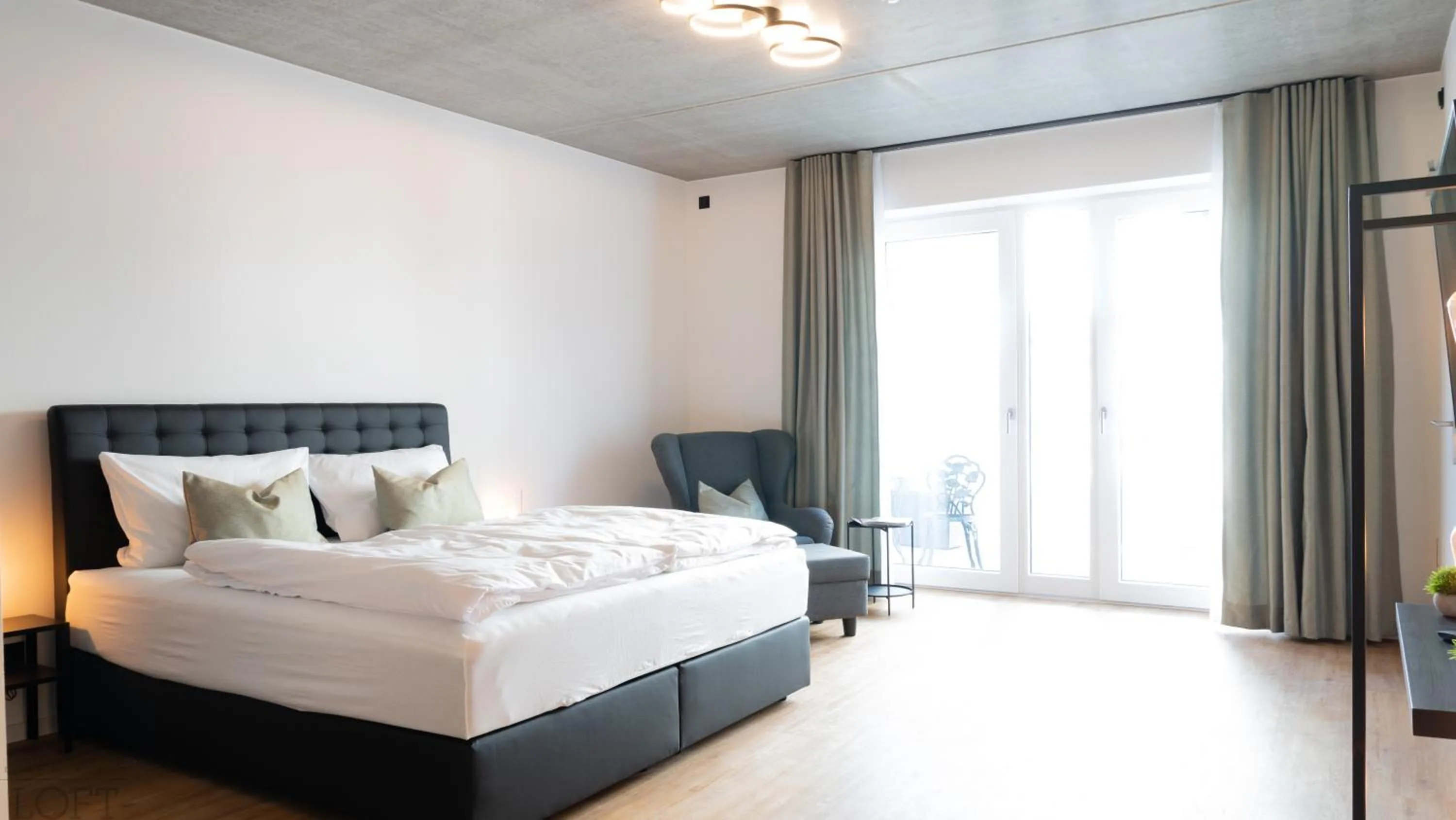 Bed in LÜTTES LOFT Boutique Hotel