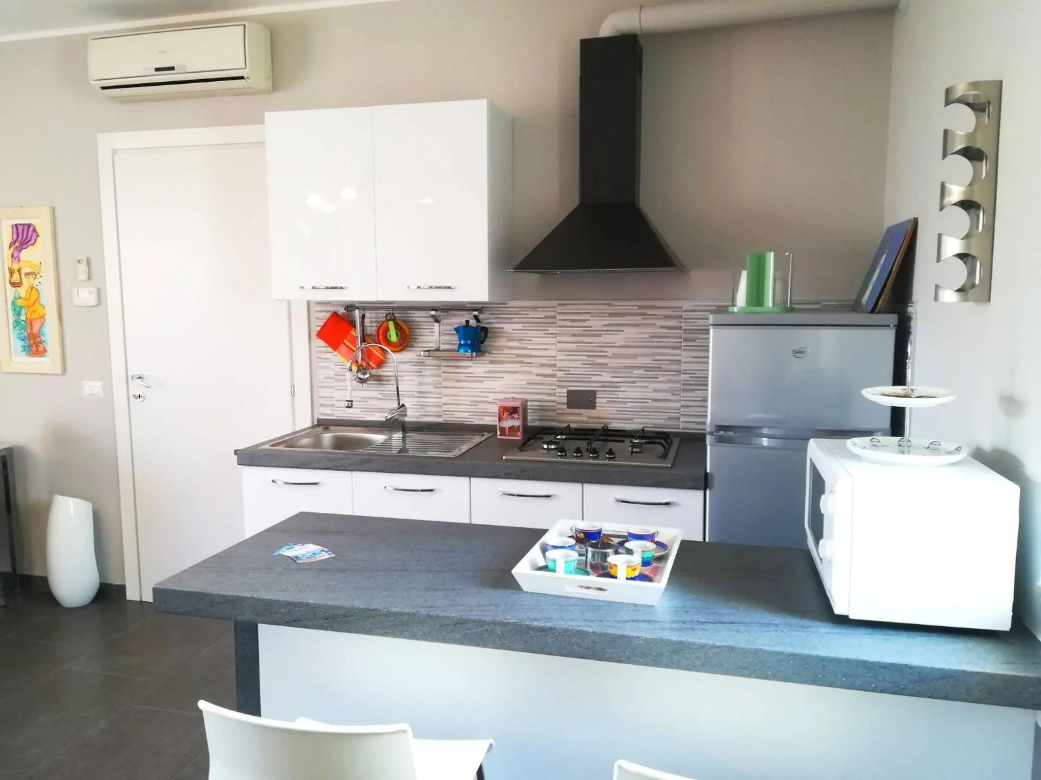 kitchen in Modern Holiday Apartment With Wi-fi, Air Conditioning And Balcony; Pets Allowed