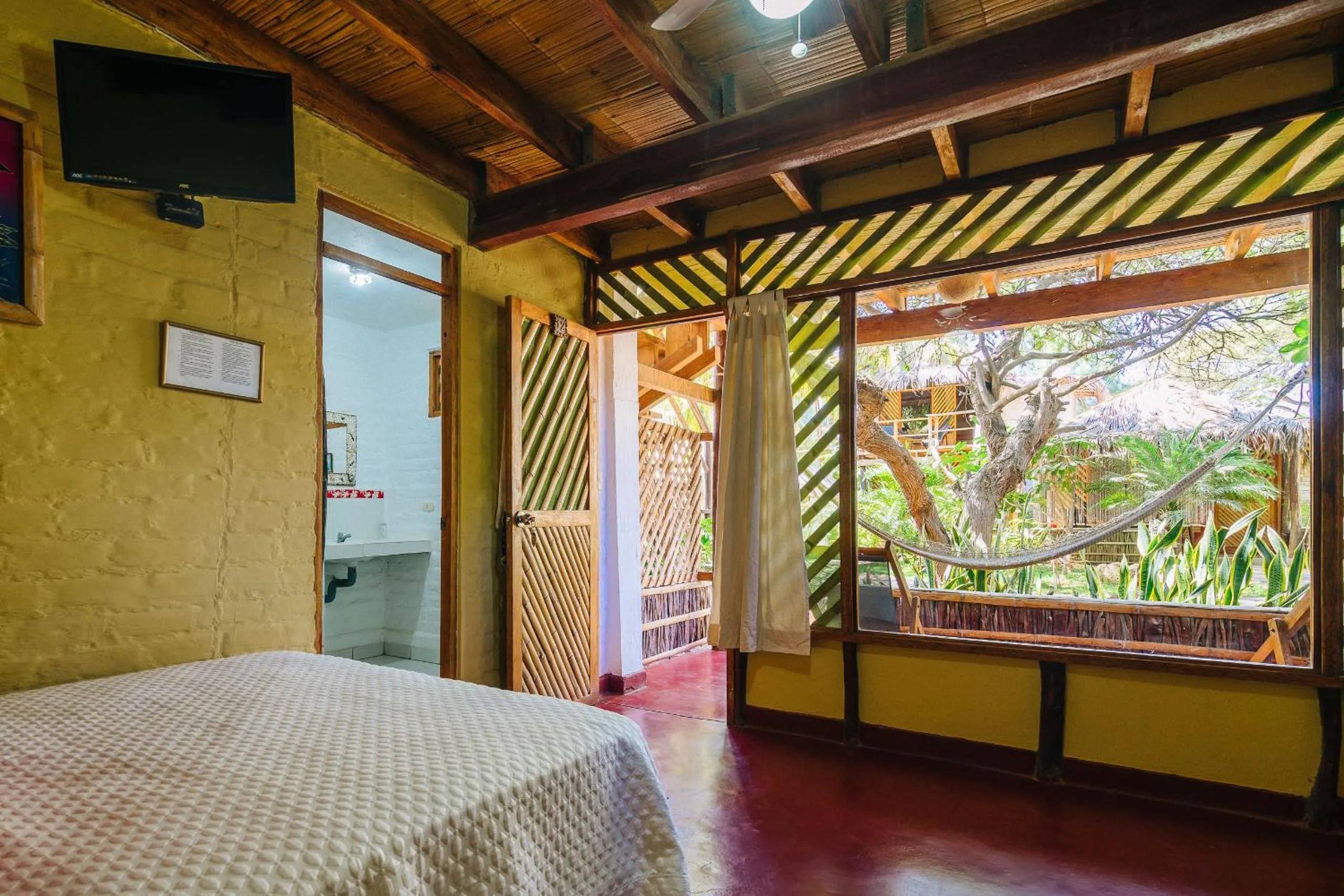 Bed in Kimbas Bungalows Mancora