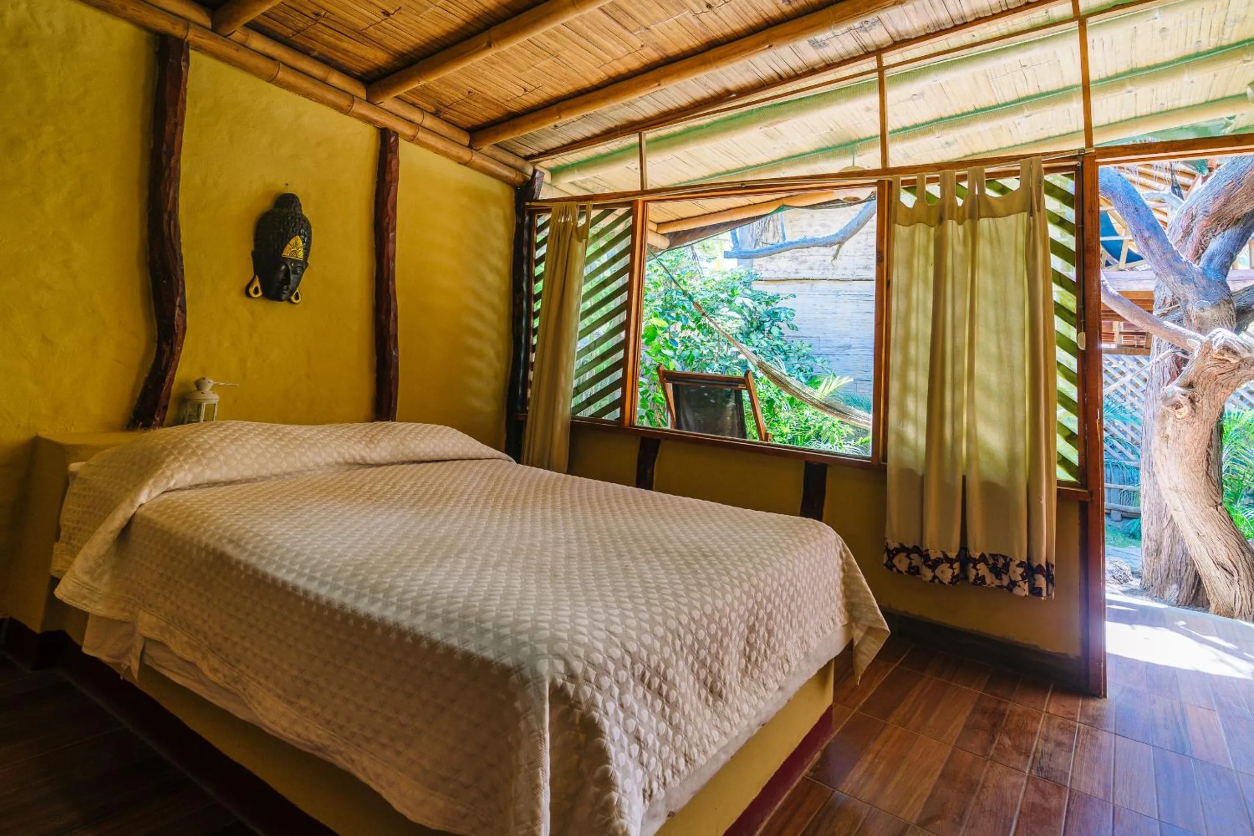 Bed in Kimbas Bungalows Mancora