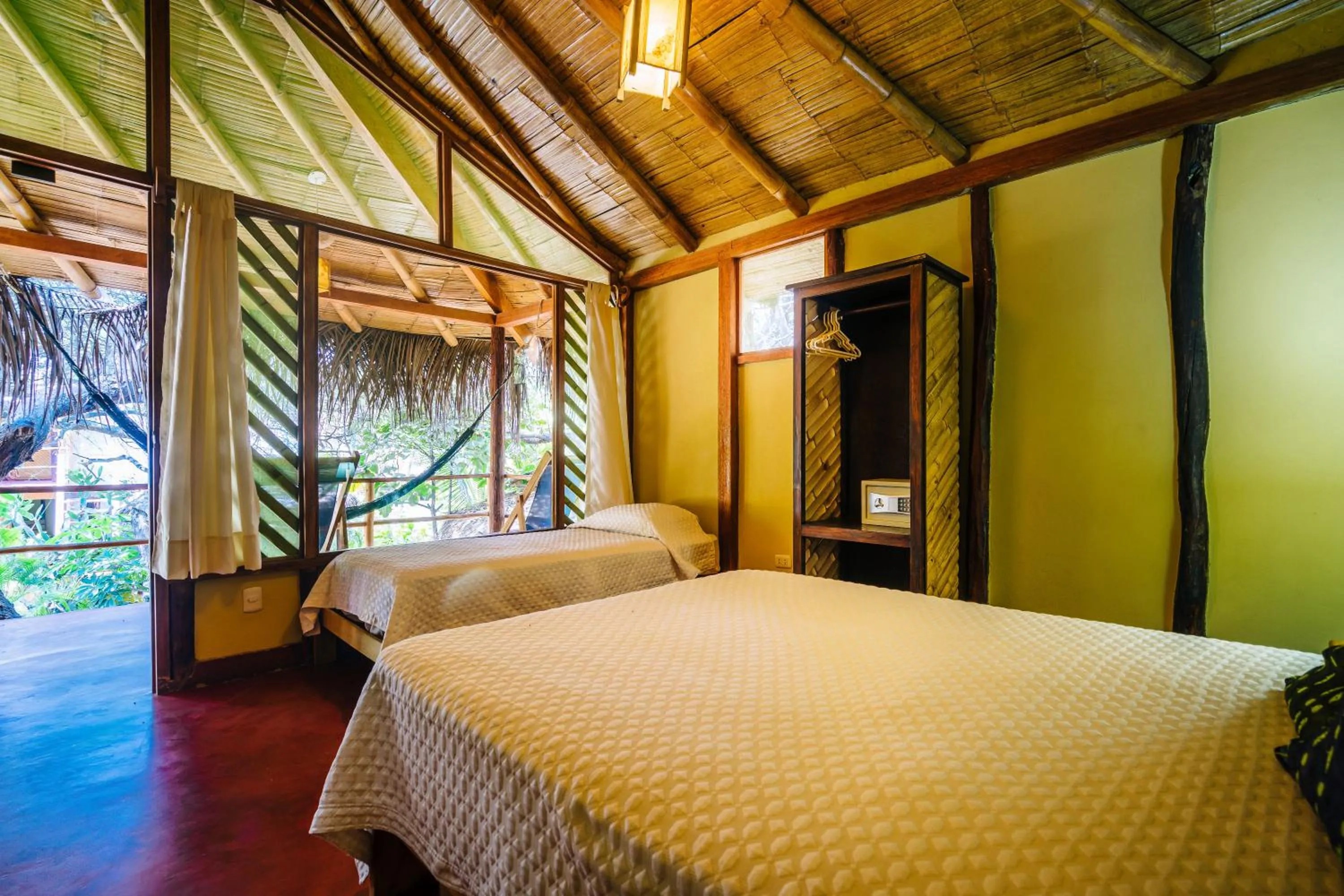 Bed in Kimbas Bungalows Mancora