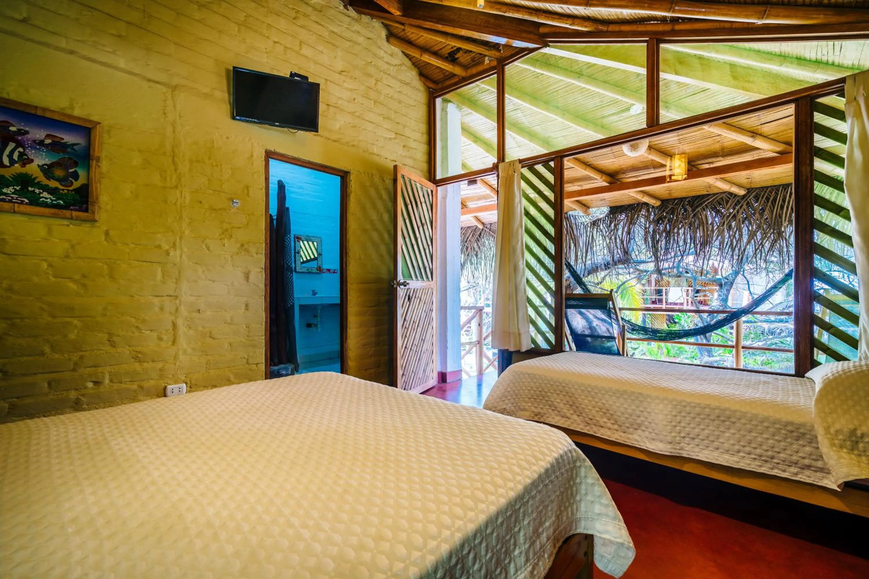 Bed in Kimbas Bungalows Mancora