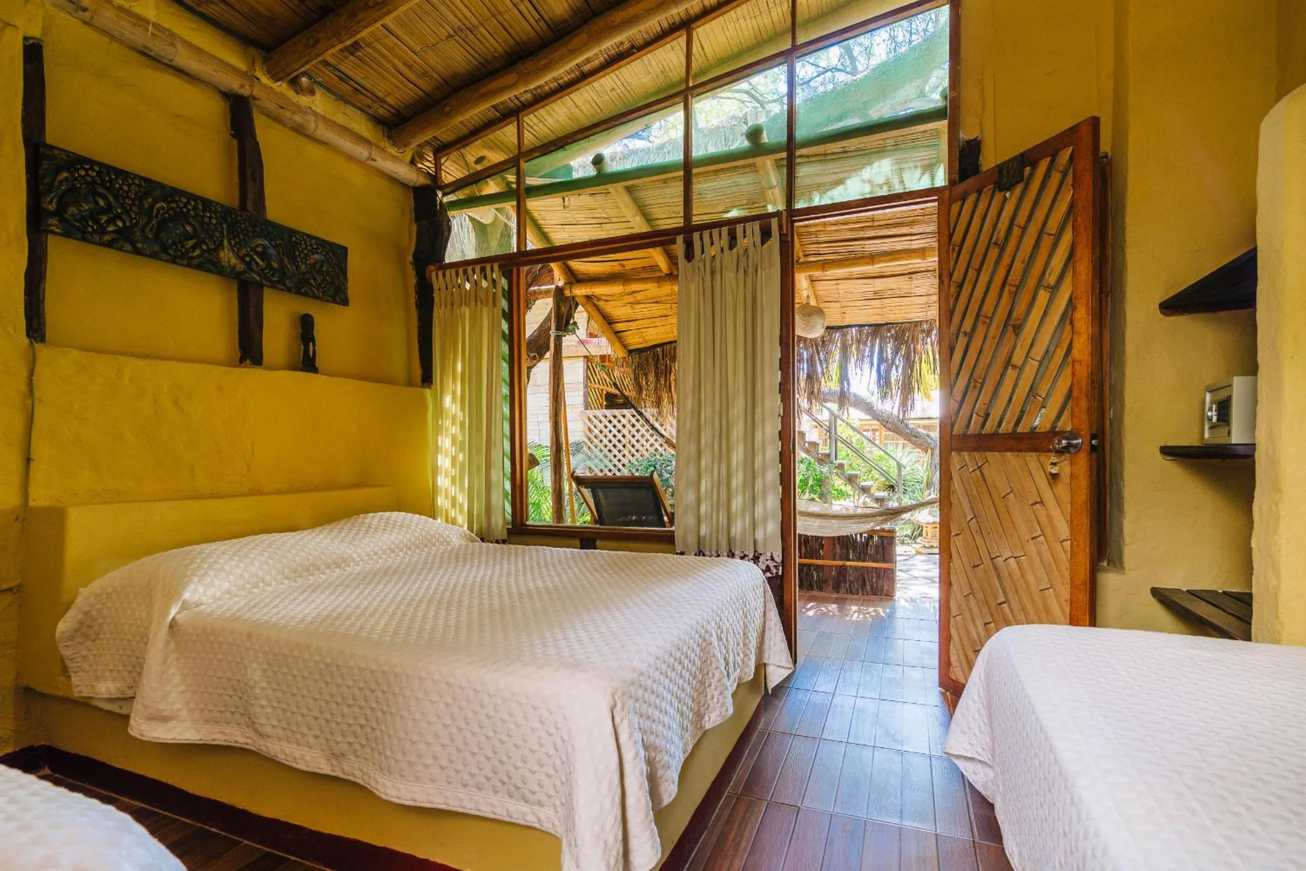 Bed in Kimbas Bungalows Mancora