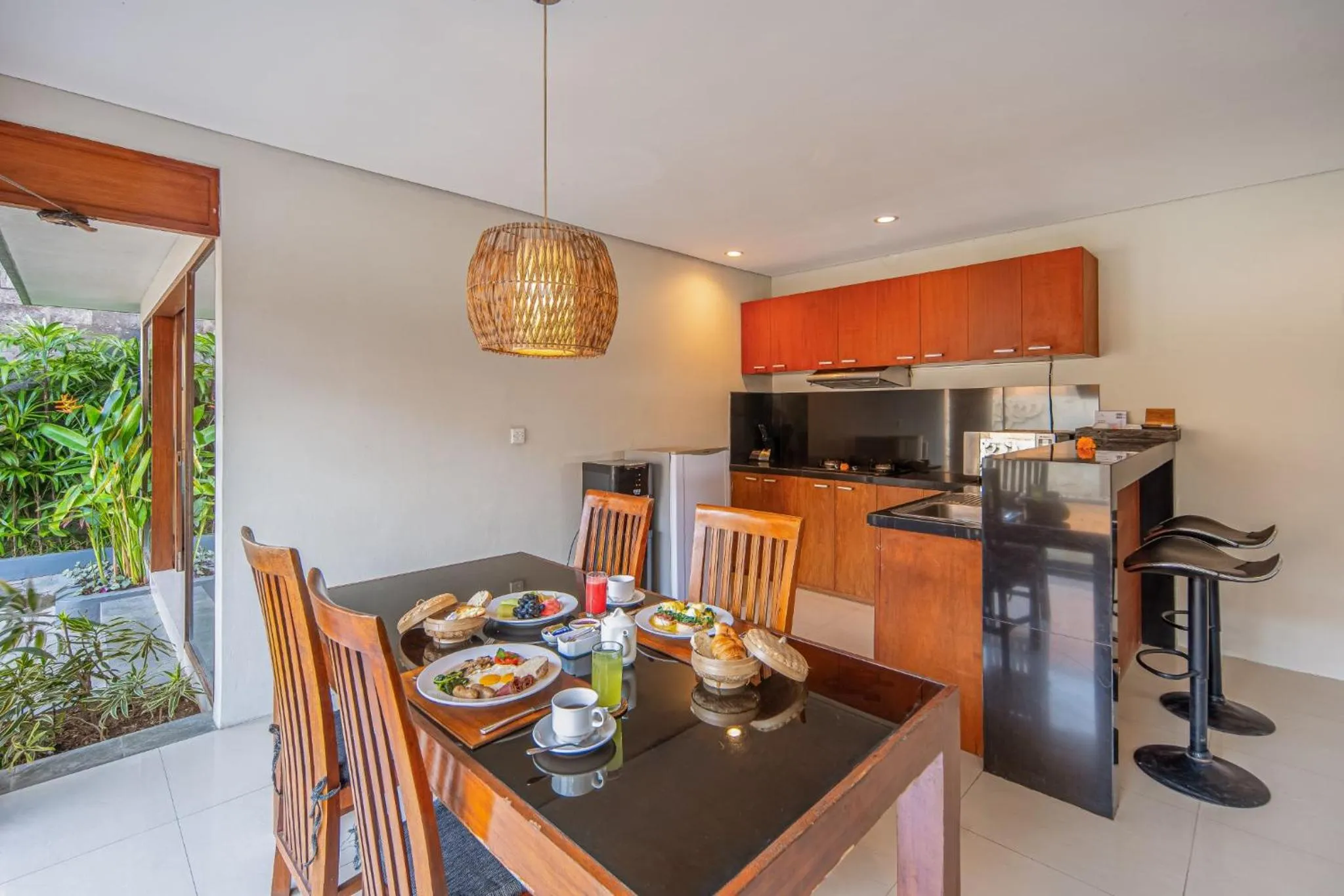 kitchen in Nyanyi Sanctuary Villa Tabanan by Ini Vie Hospitality