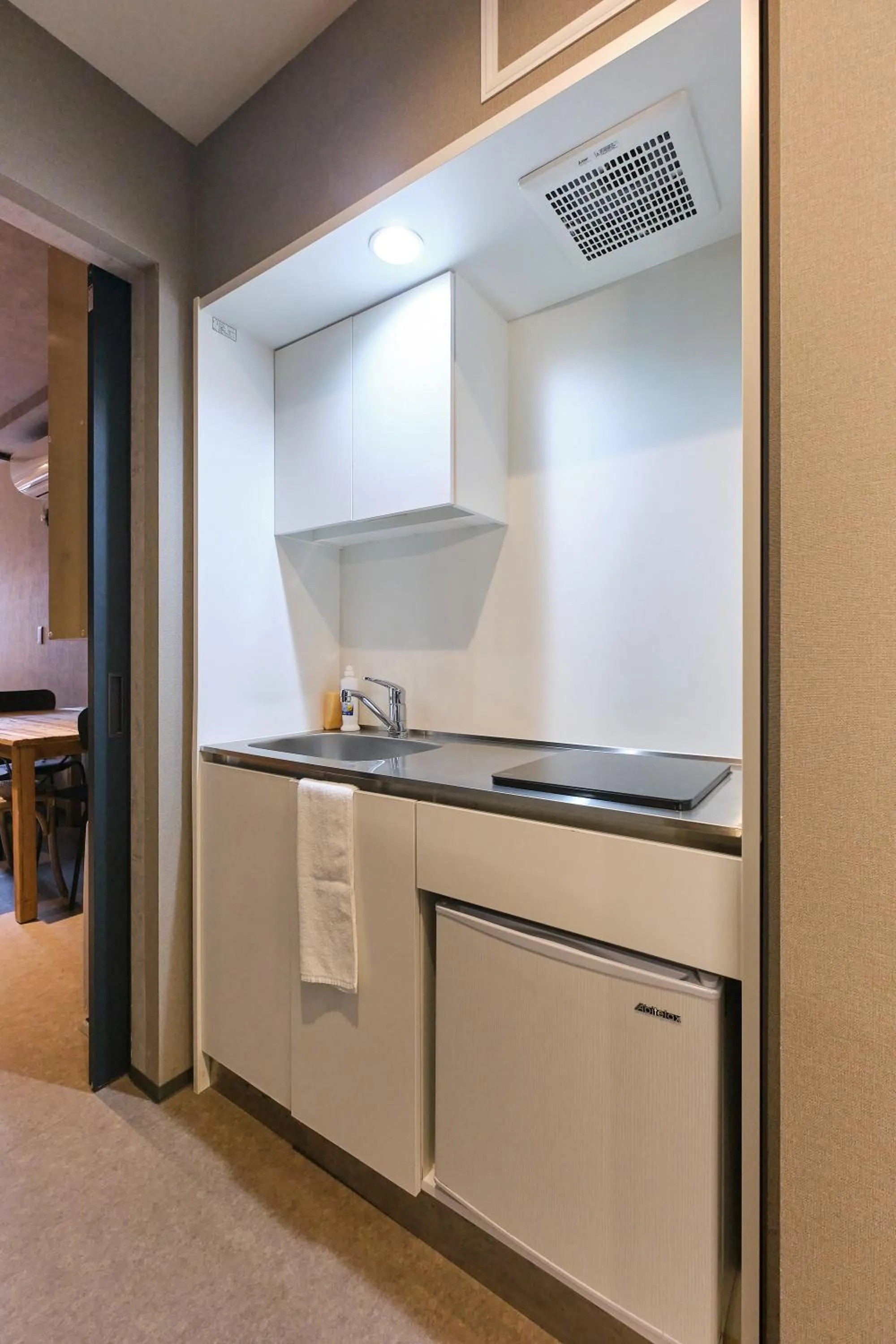 kitchen in UCHI SUSUKINO WEST by Hotel Wheat